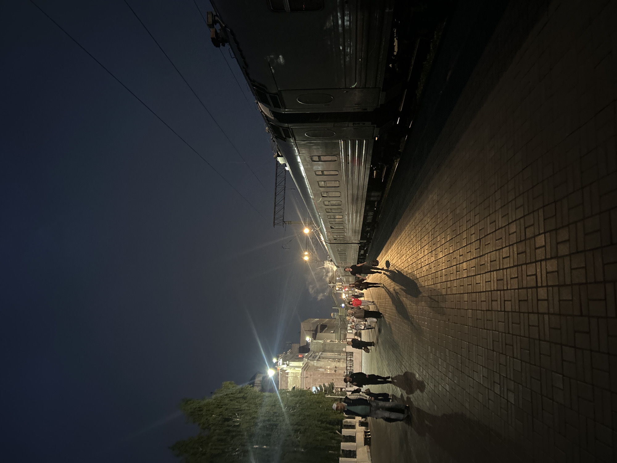 Nighttime scenes captured across Izhevsk showing cityscape and railway station