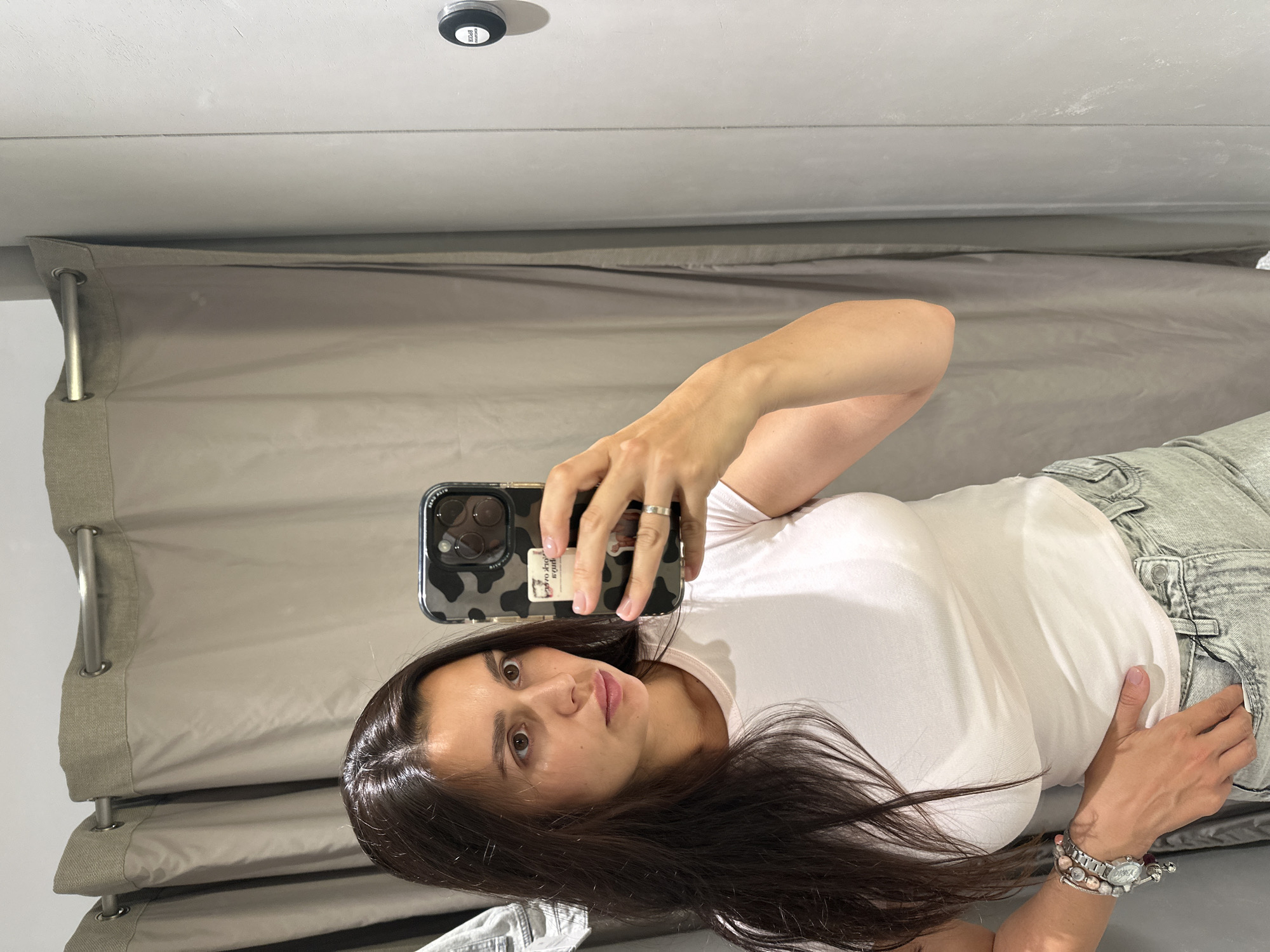Fitting room mirror selfies during a shopping stop in Perm