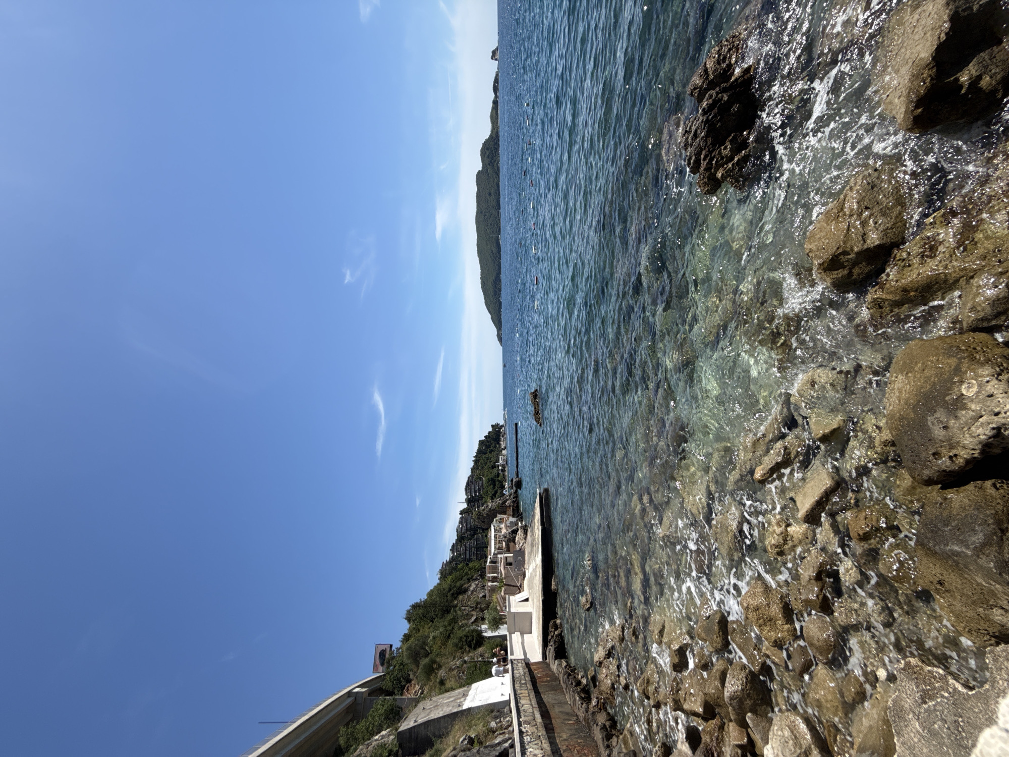 Beach day in Budva: coastline, paragliding, and street-level scenes