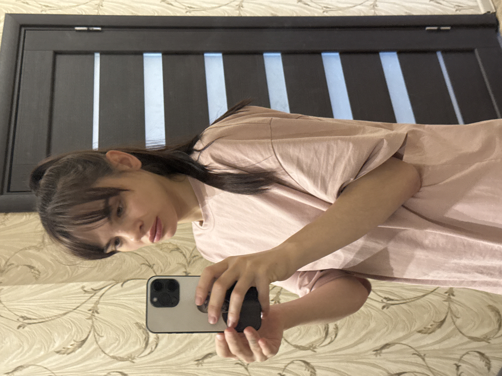 Woman takes mirror selfies in Rostov-on-Don apartment