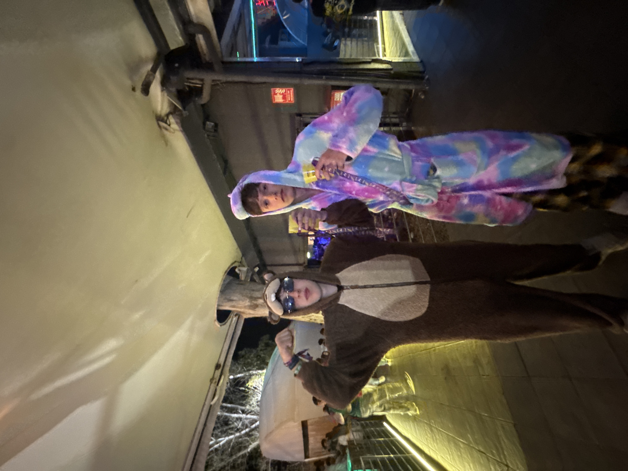 Costumed young men gather at indoor parties in Gandia
