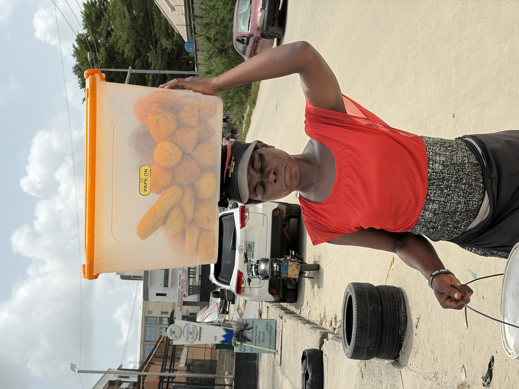 Street vendor, raised dump truck observed in Igboefon Nigeria