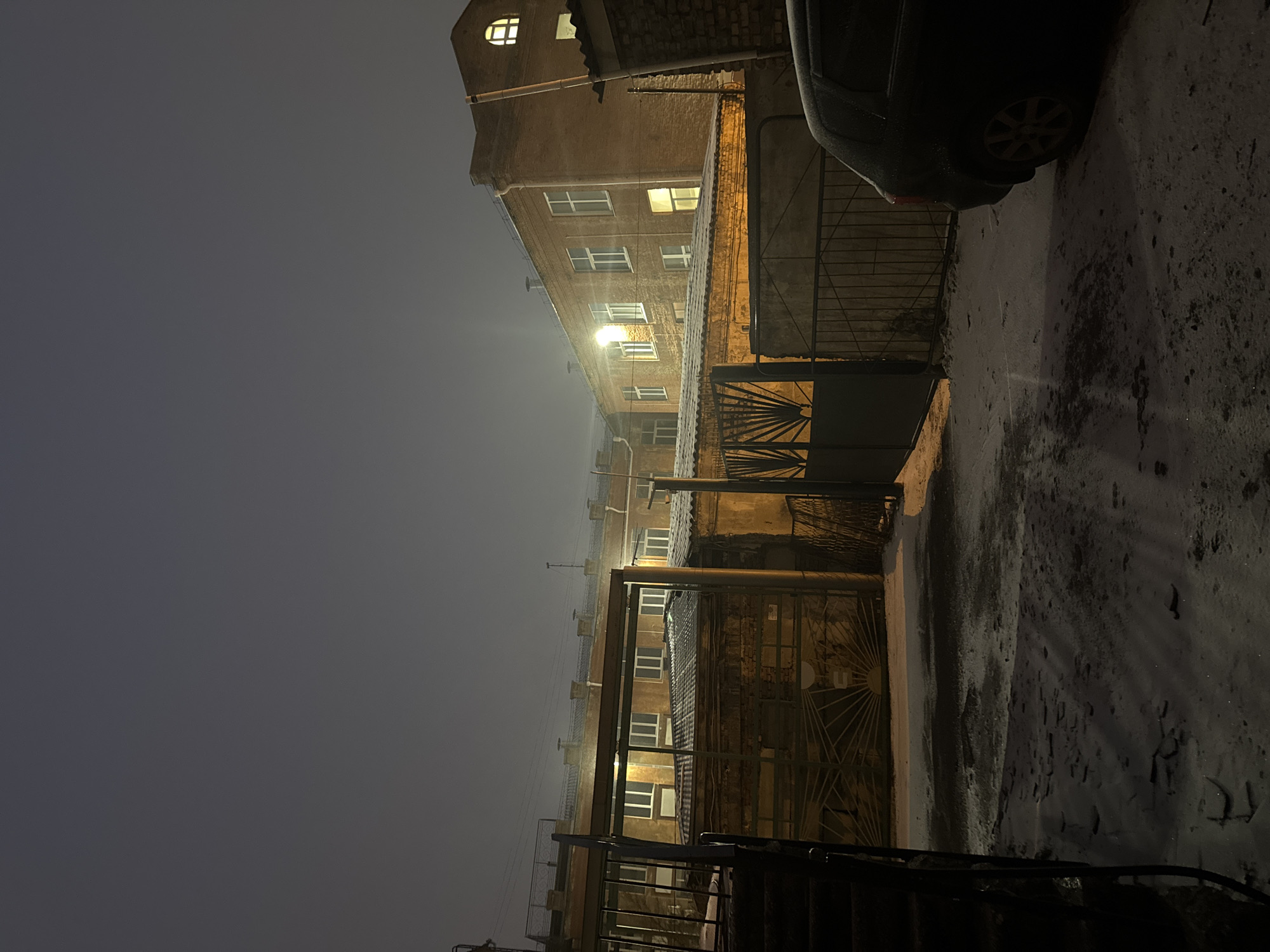 Foggy night courtyard scene documented in Krasnoyarsk, Russia