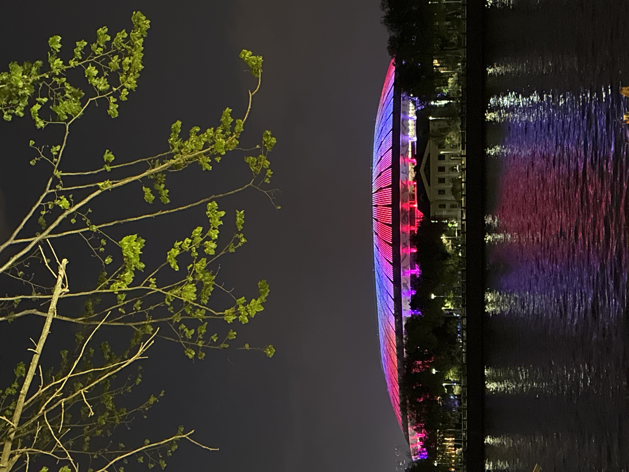 Rainy evening in Moscow with illuminated building, wet streets
