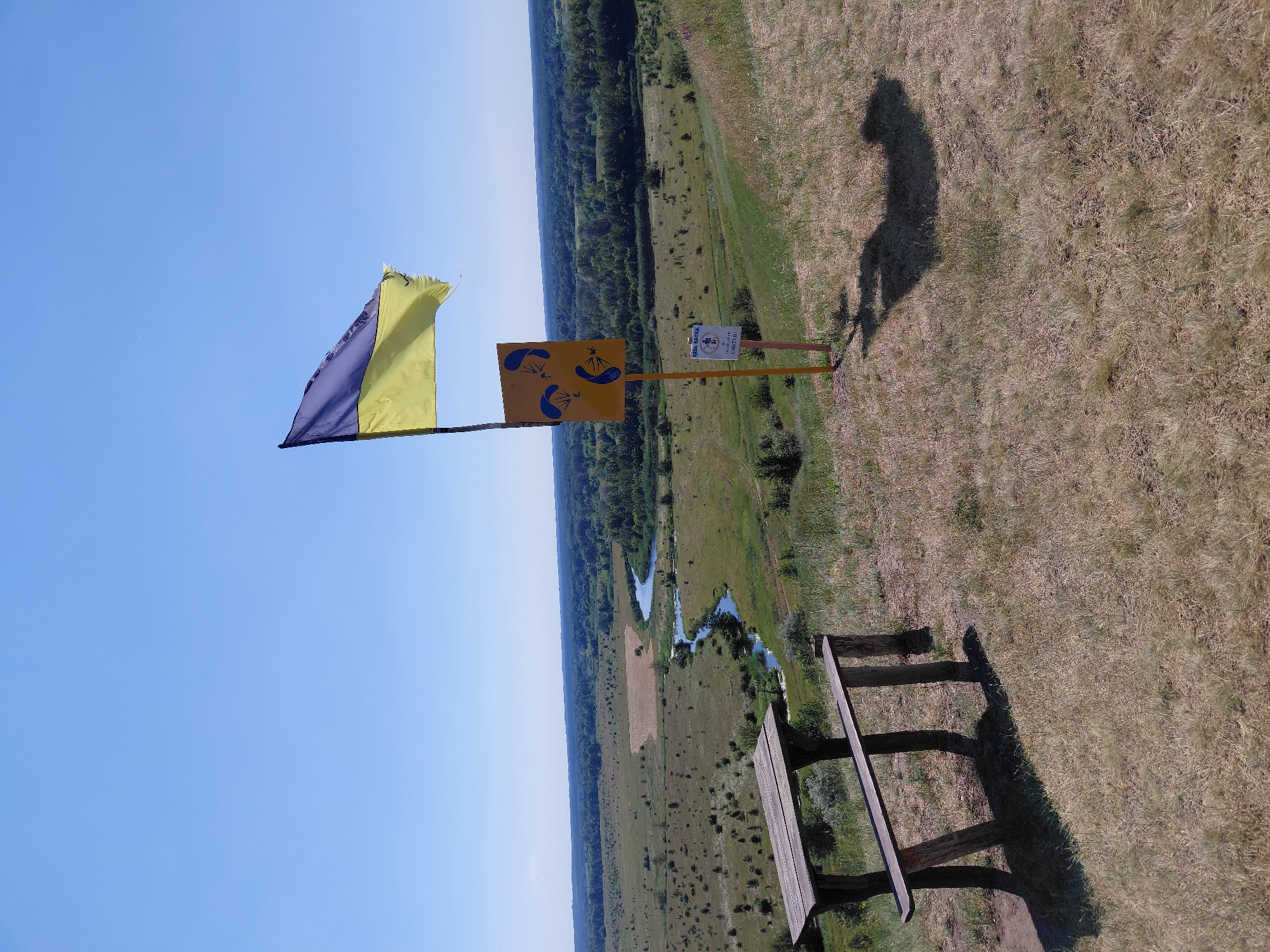 Hilltop overlook in Ustyvytsia with flag, swings, and rural views