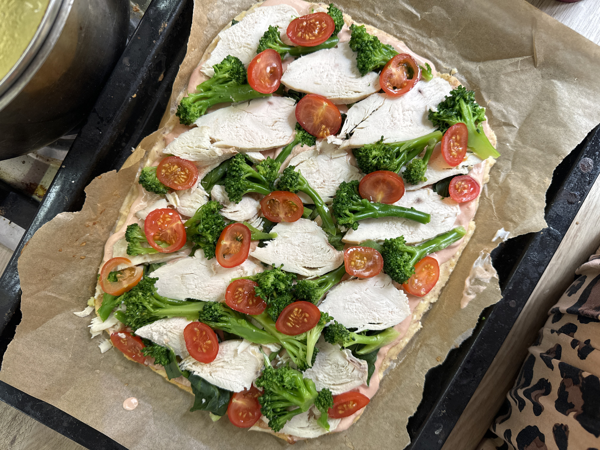 Home cook prepares chicken and vegetable pizza in Krasnoyarsk