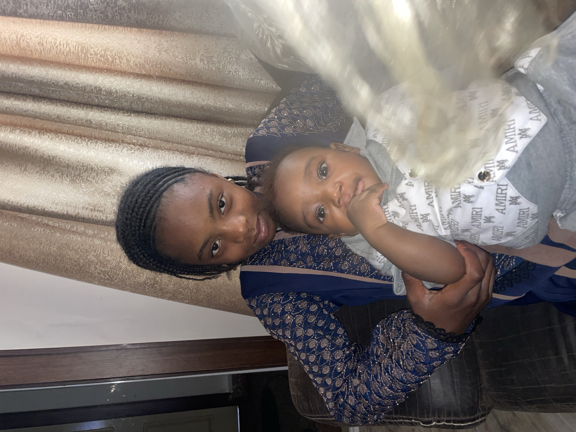 Mother and infant captured in quiet moment in Jos