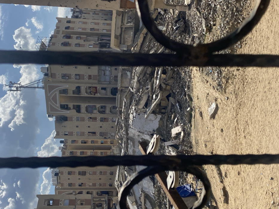 Structural damage documented in Khan Yunis through security bars