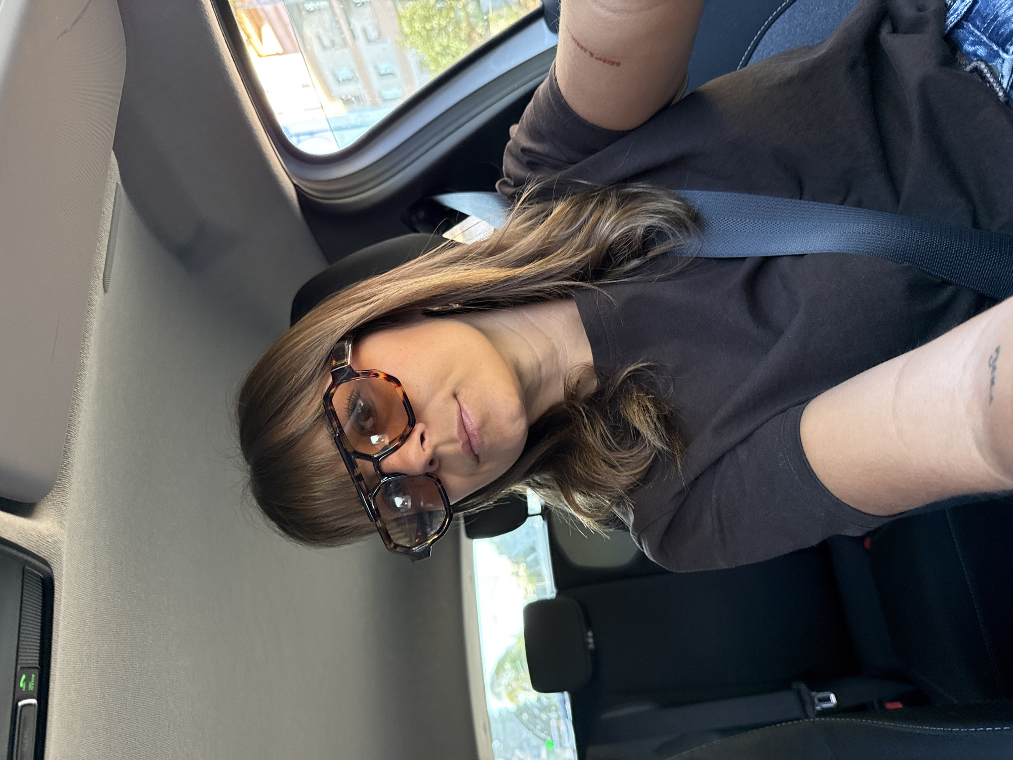 Woman takes selfie in car in Le Cannet, France
