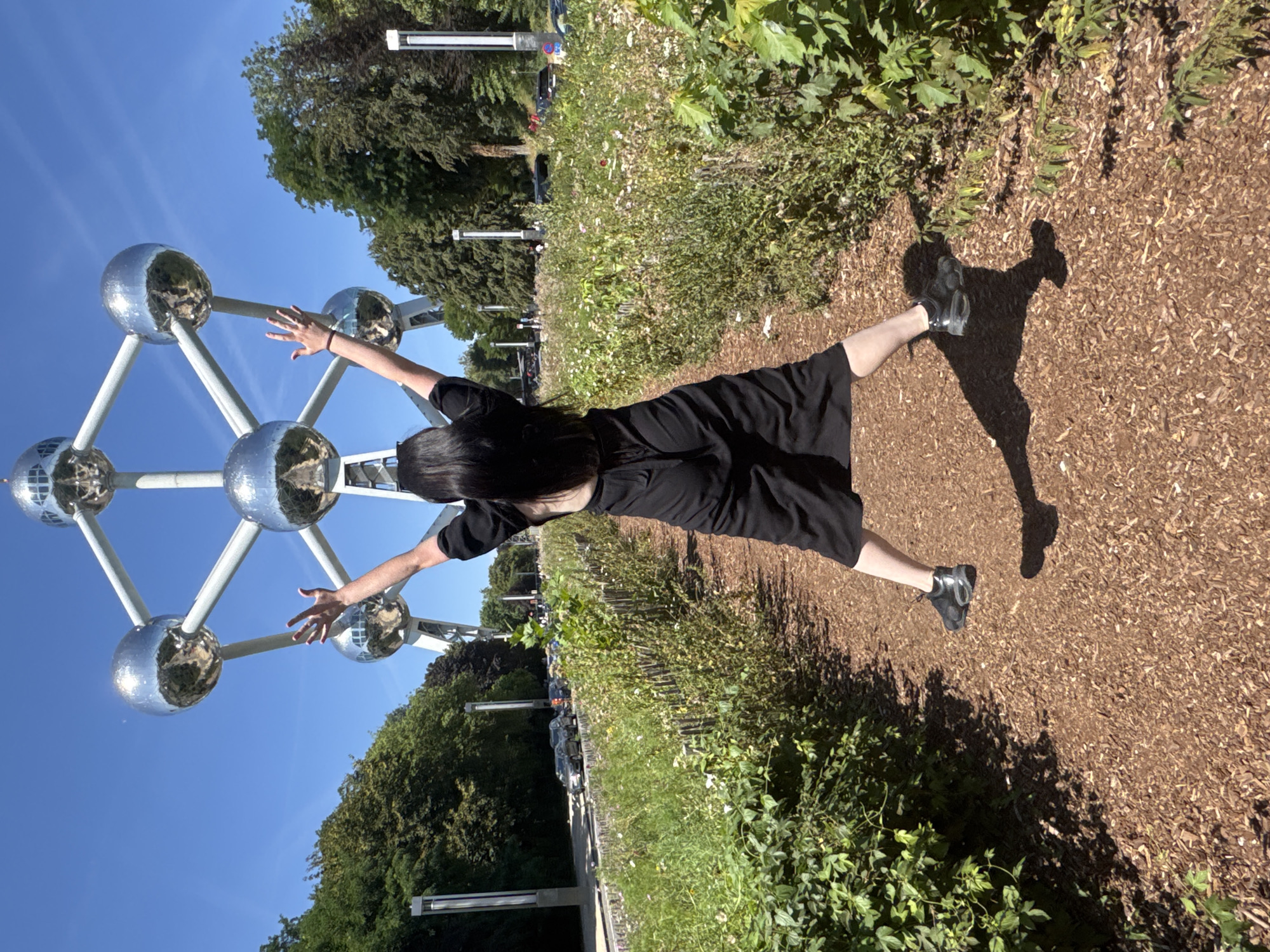 Sunny afternoon at Brussels' Atomium and surrounding sculptures.