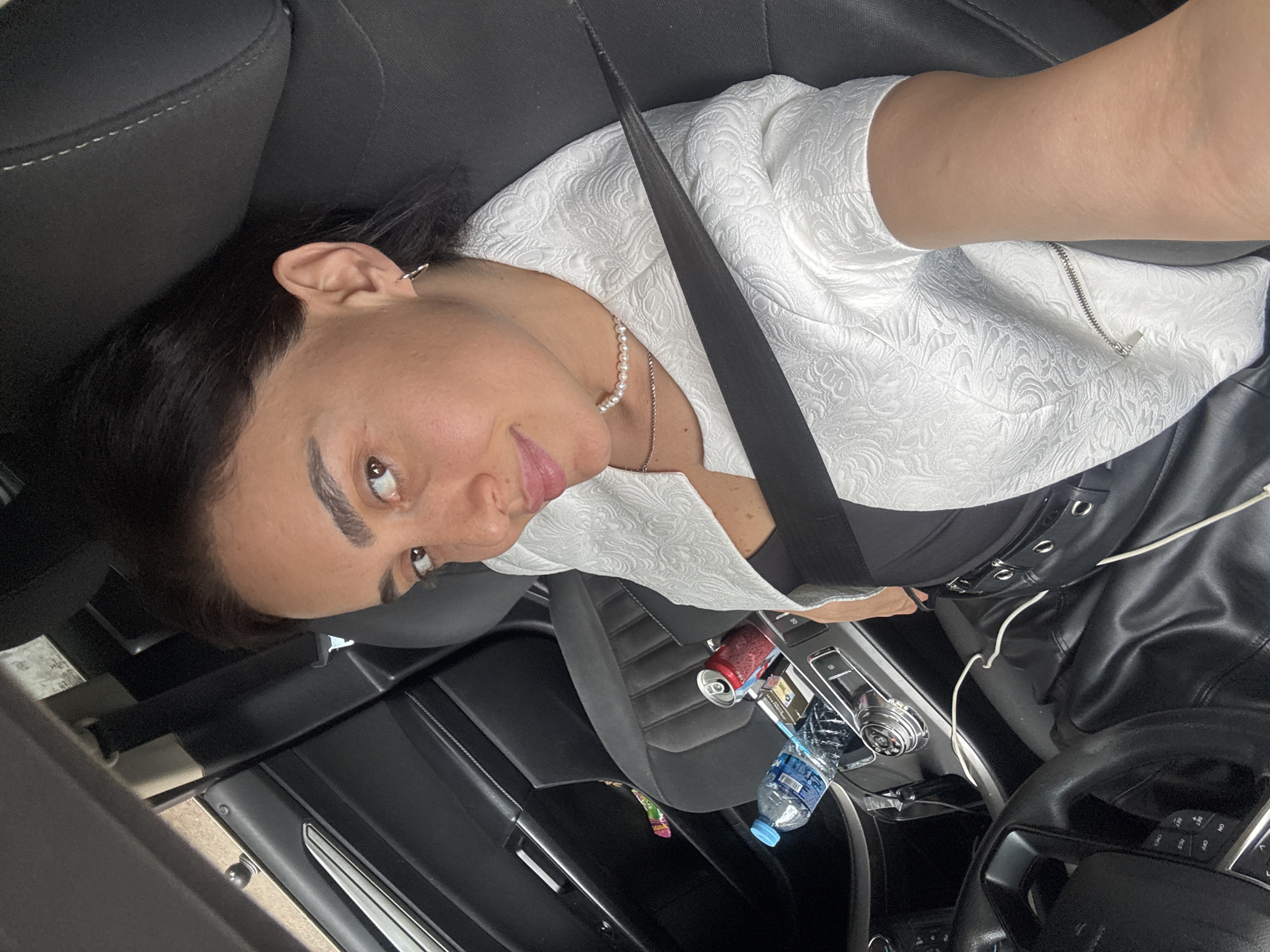 Woman poses for car selfies during Tbilisi street photography session