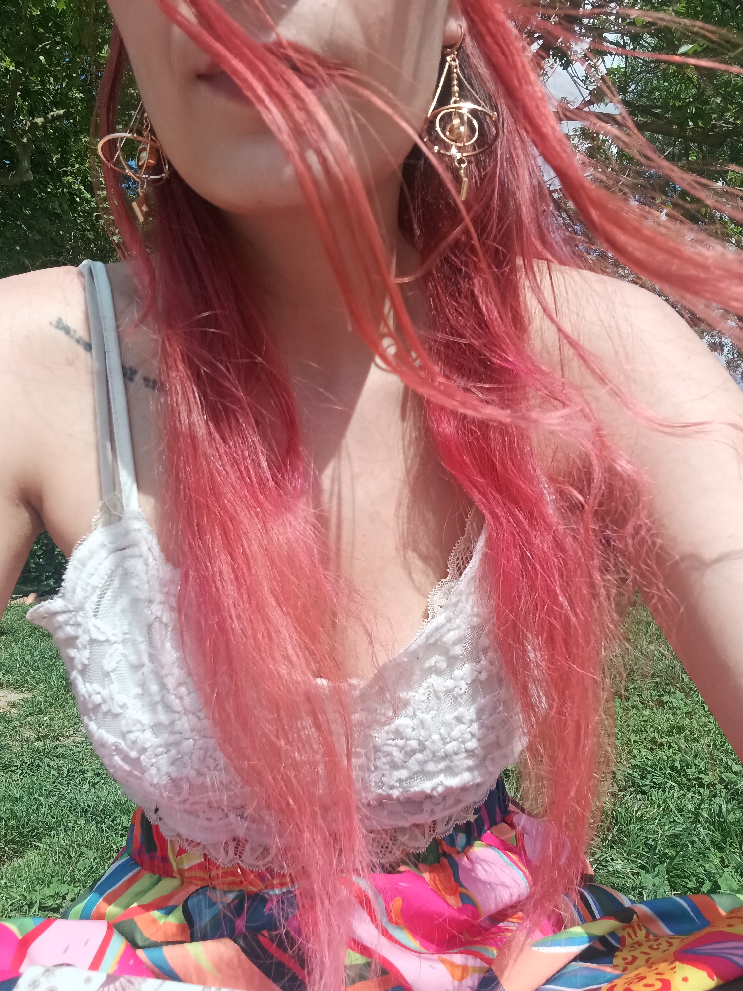 Pink-haired visitor documents leisurely afternoon walk through historic Toulouse