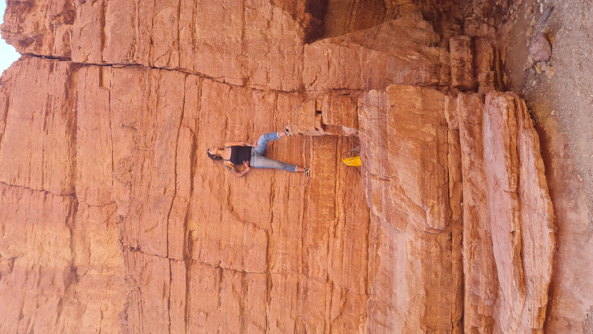 Woman explores desert canyons in southern Israel before dawn