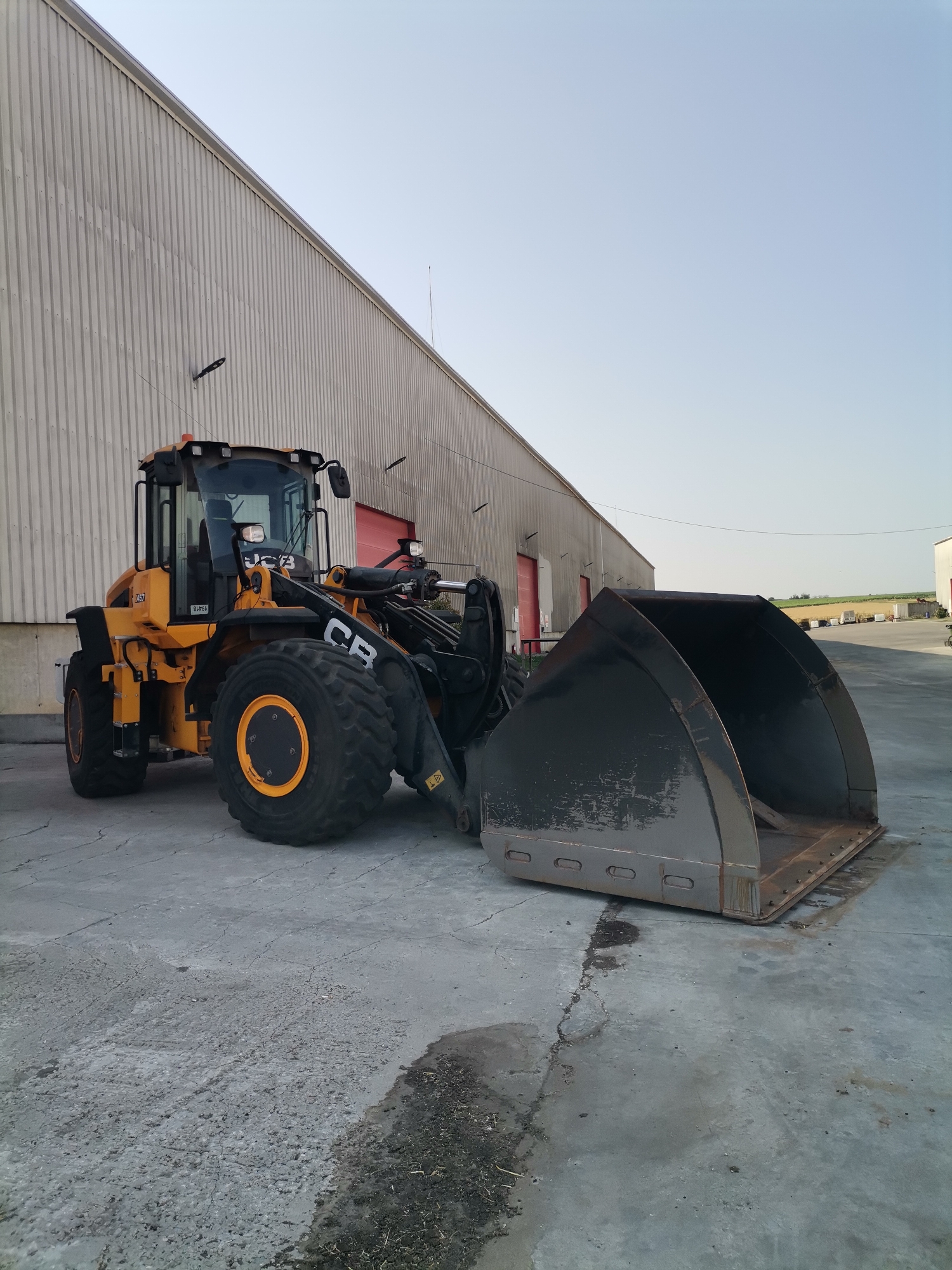 Industrial yard activity in Slanchevo with heavy vehicles and equipment