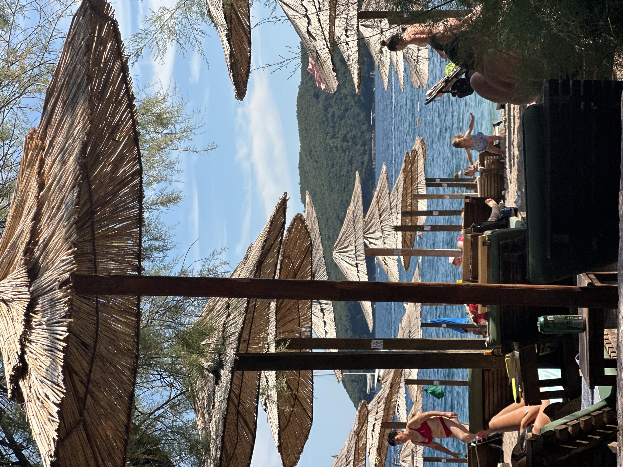 Budva's beaches and Adriatic waterfront on a busy summer afternoon