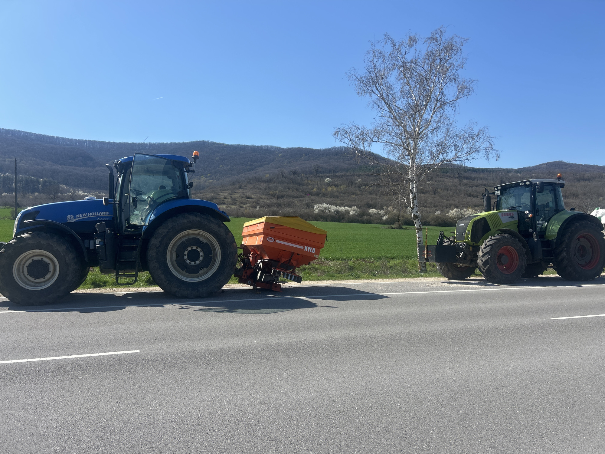 Tractors parked on rural road in Gradishte, Bulgaria