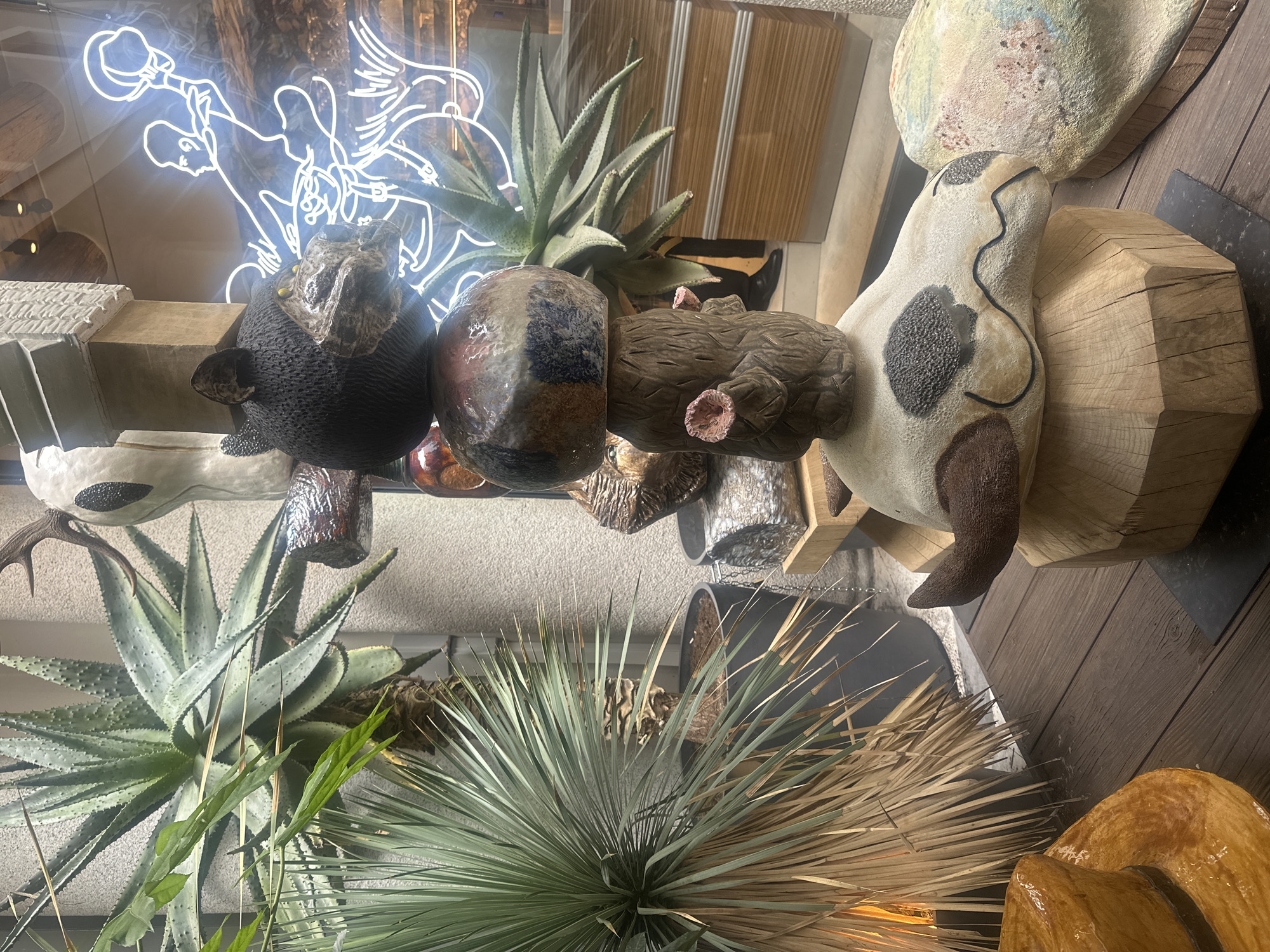 Art display with sculptures and plants spotted in Milan shop