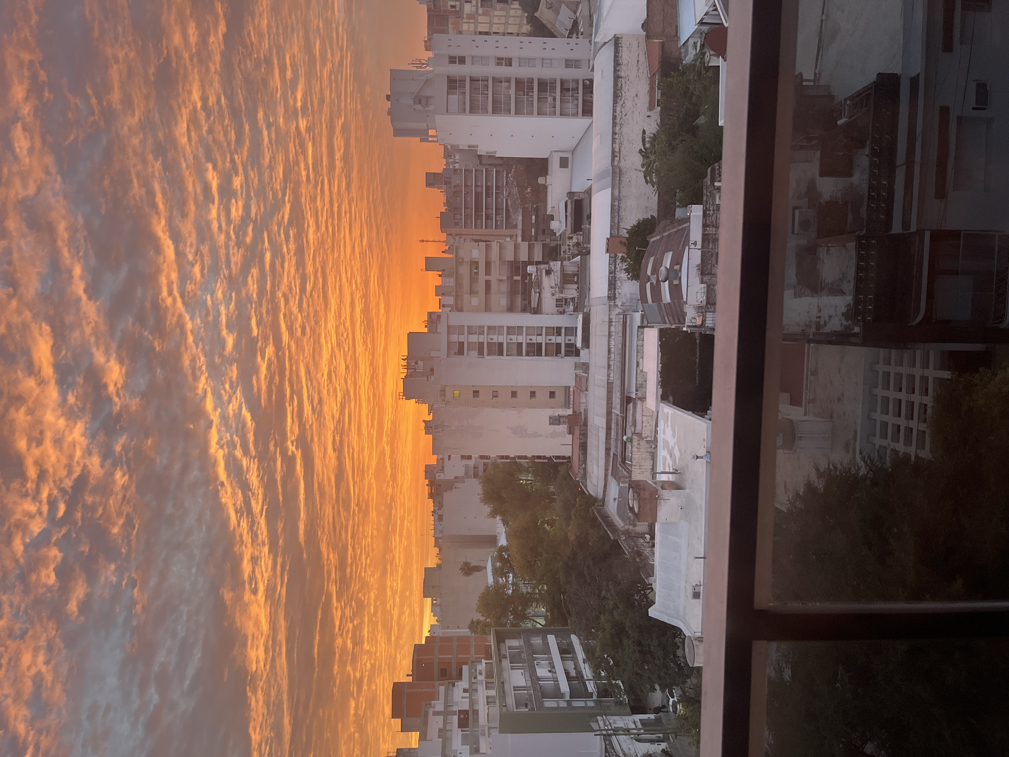 Sunset illuminates Córdoba skyline with orange mammatus clouds