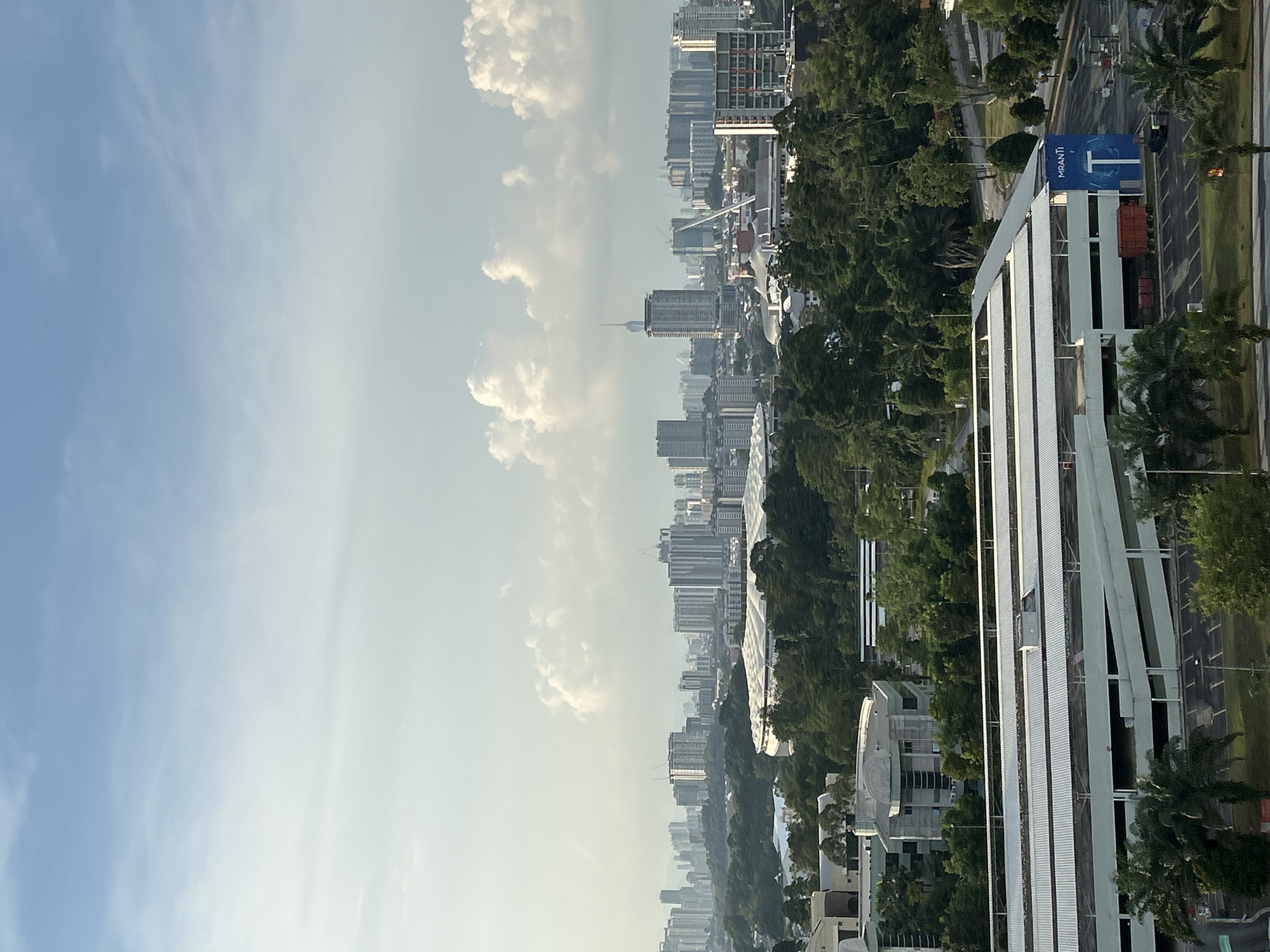 Elevated views capture Kuala Lumpur skyline on clear day