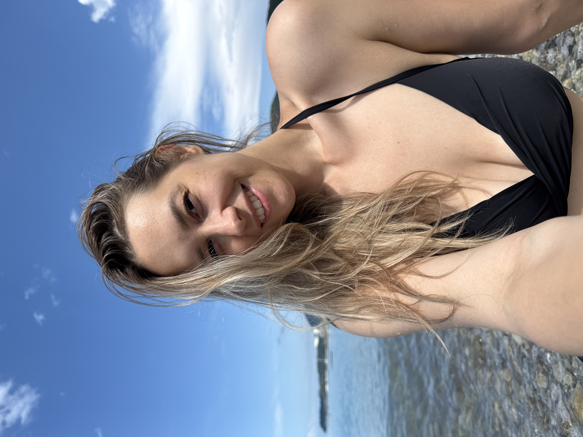 Woman takes beach selfies in Nebug, Russia morning session
