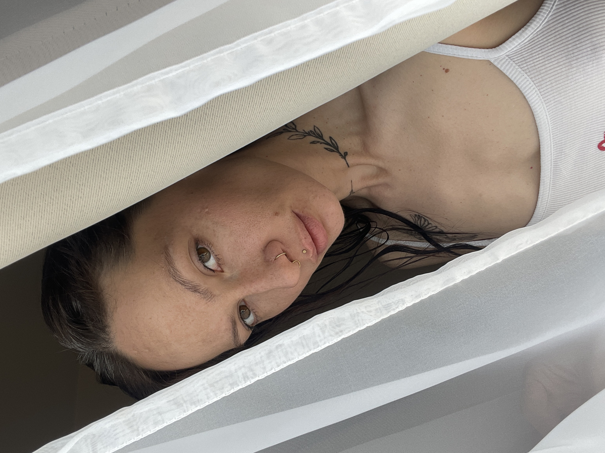 Woman photographed through layered fabric in Izhevsk