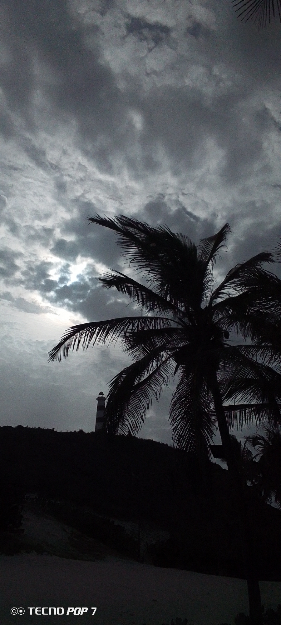 Storm clouds gather over lighthouse in Pedro González, Venezuela