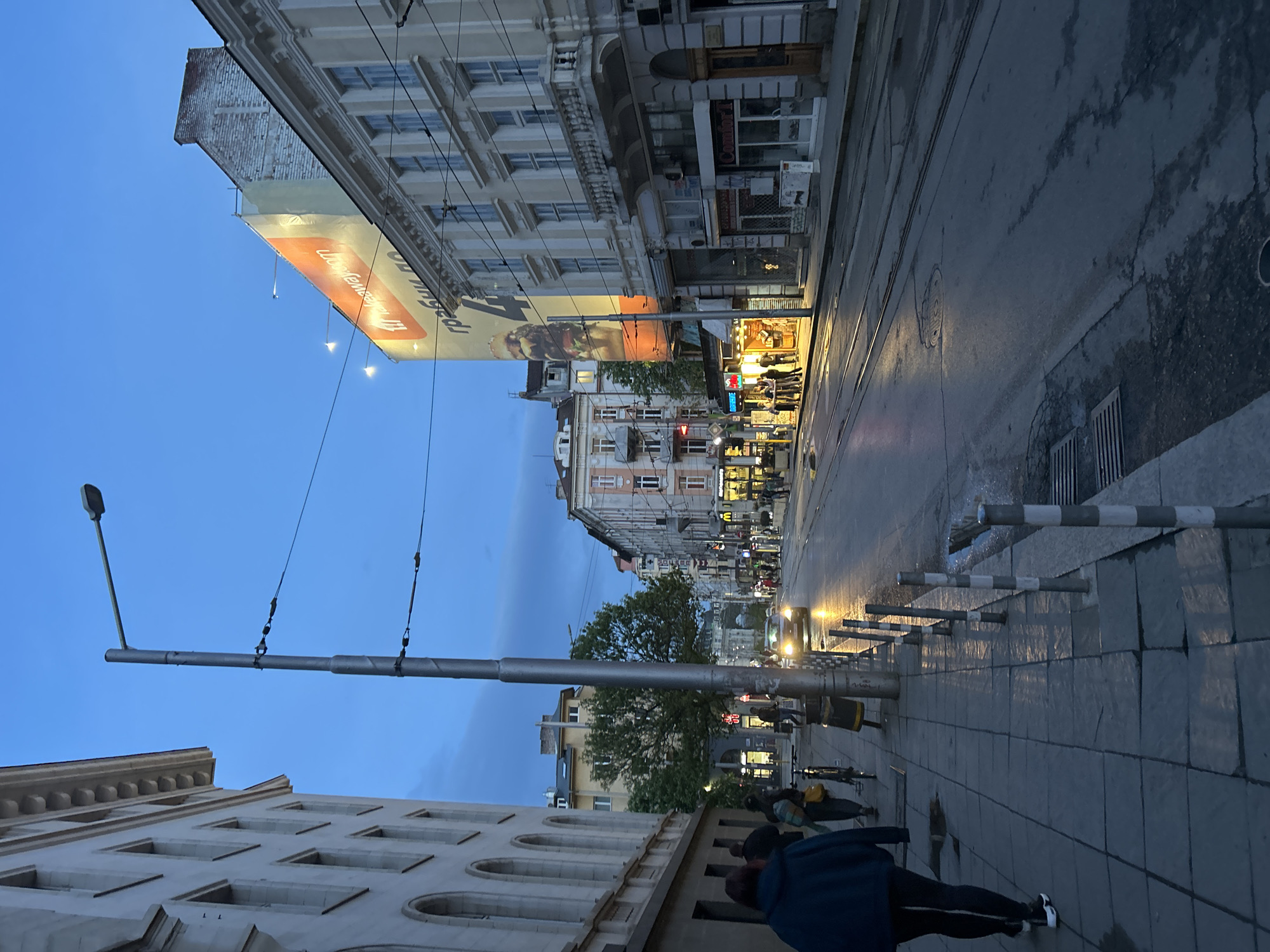 Dusk street scene with advertisement captured in Sofia