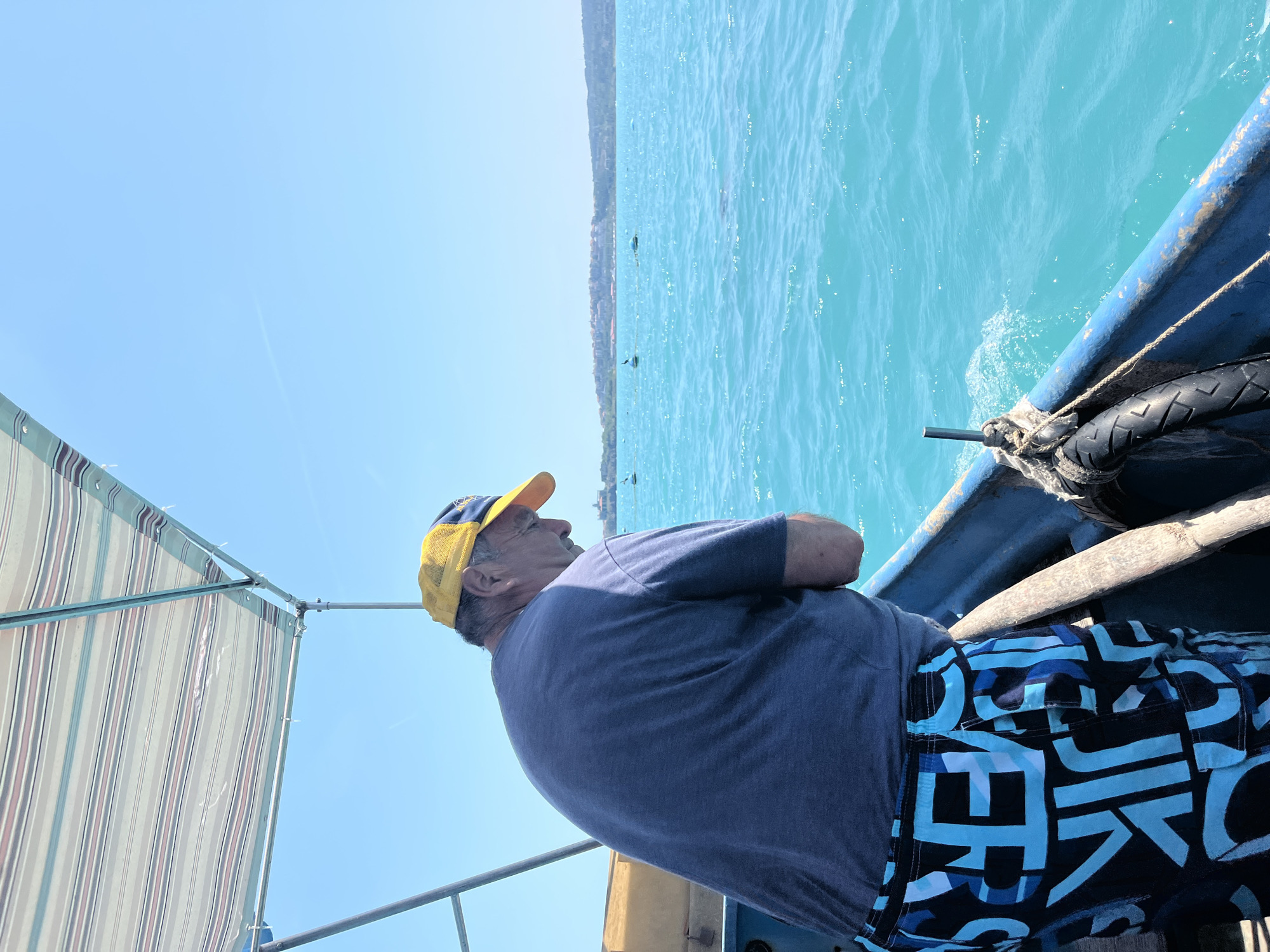 Fishing trip aboard blue boat on turquoise waters captured