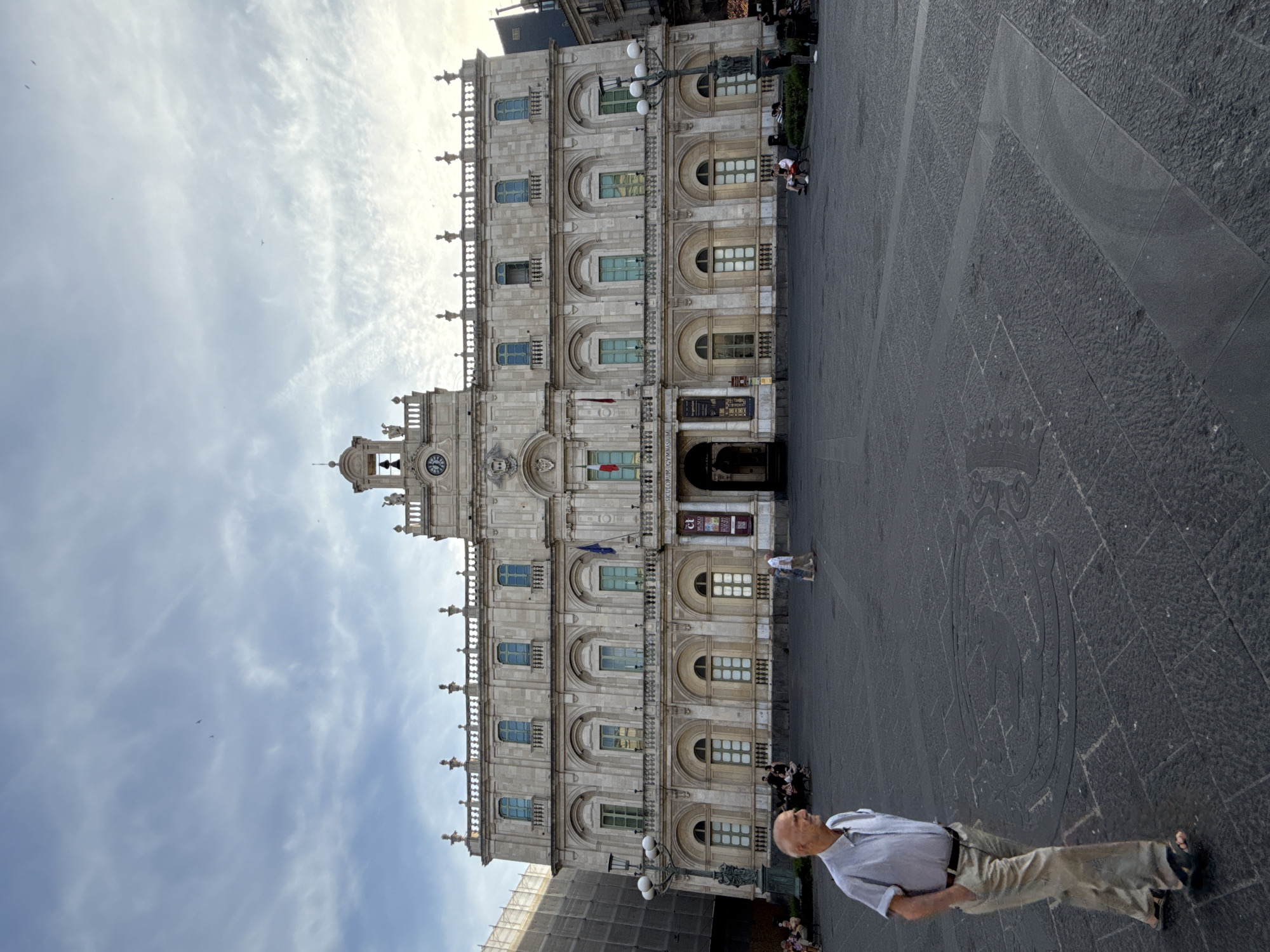 Tourist documents historic Catania landmarks and street life