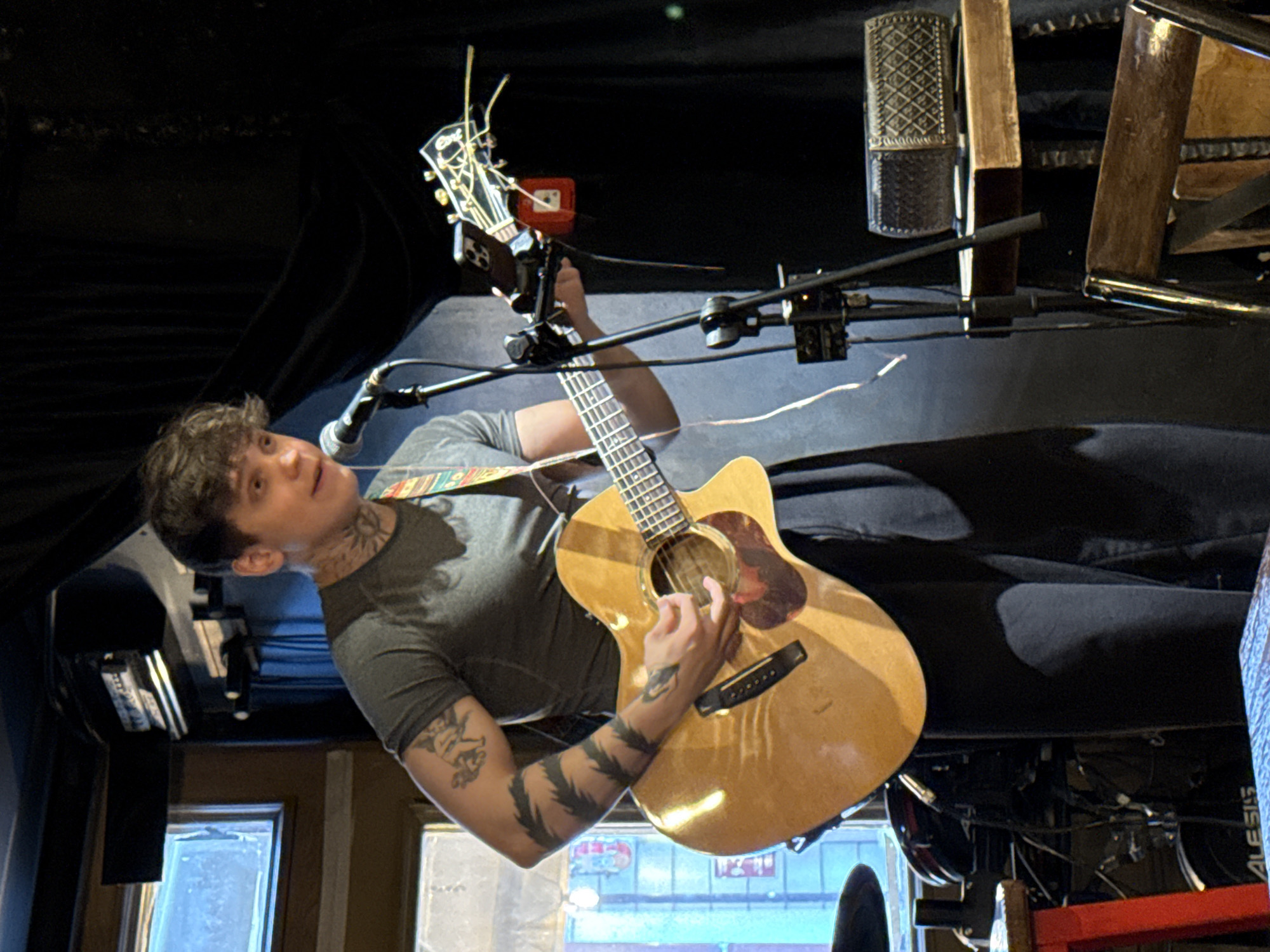 Acoustic guitar performance captured on stage in Kazan