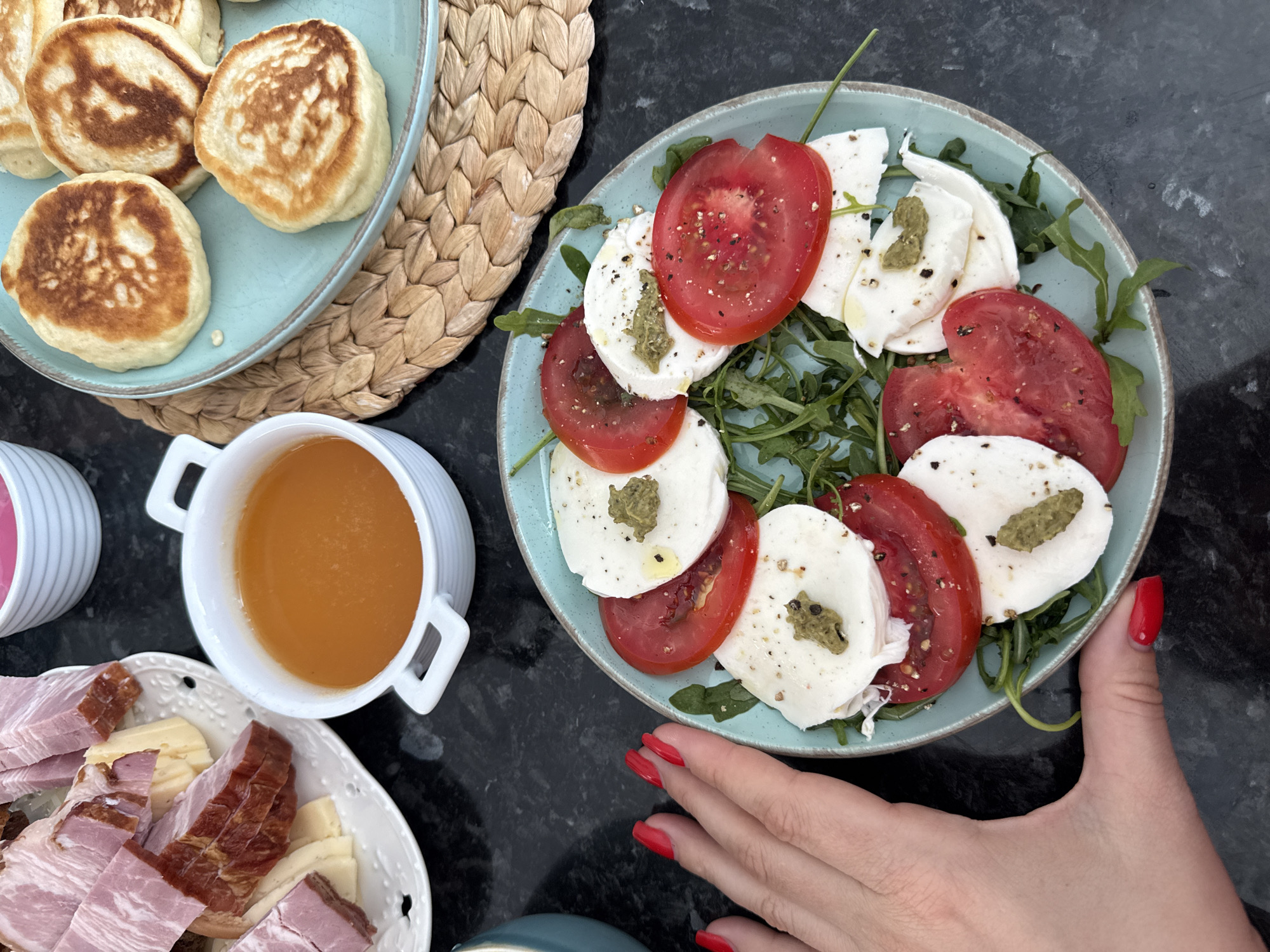 Brunch spread and a small dog at a Sochi home