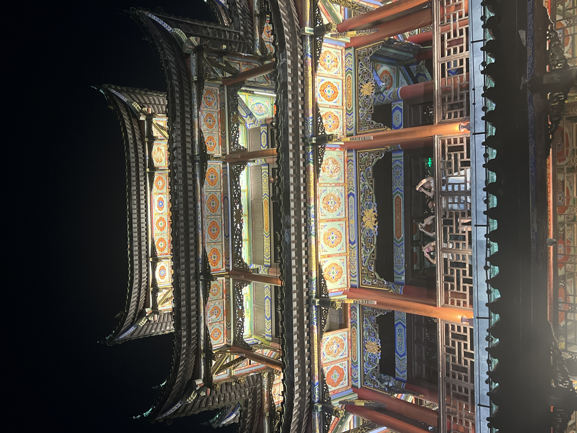 Liangjiang's traditional architecture glowing at night in Chongqing