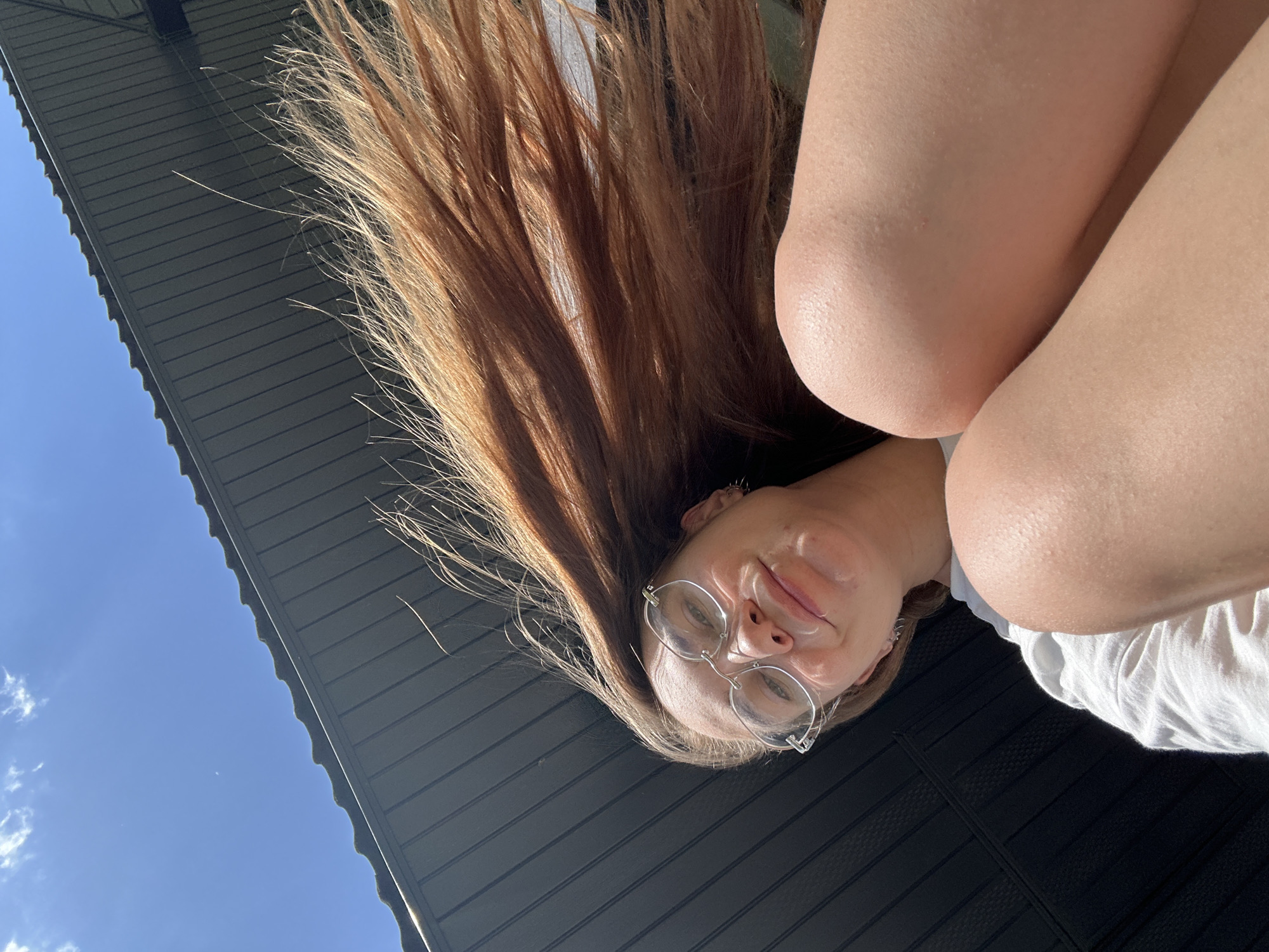 Woman photographed upside-down in Kharnavy, Russia