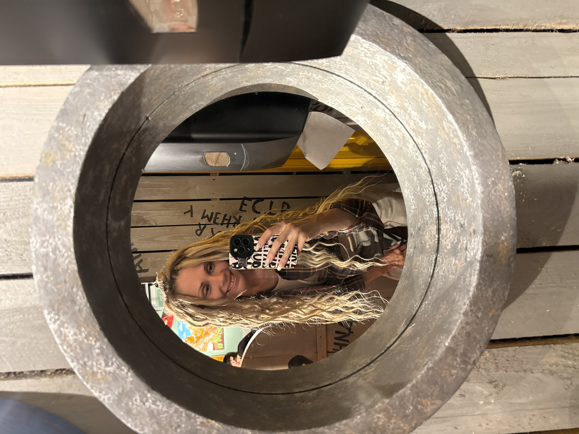 Woman takes mirror selfies in Zavolzhye restaurant