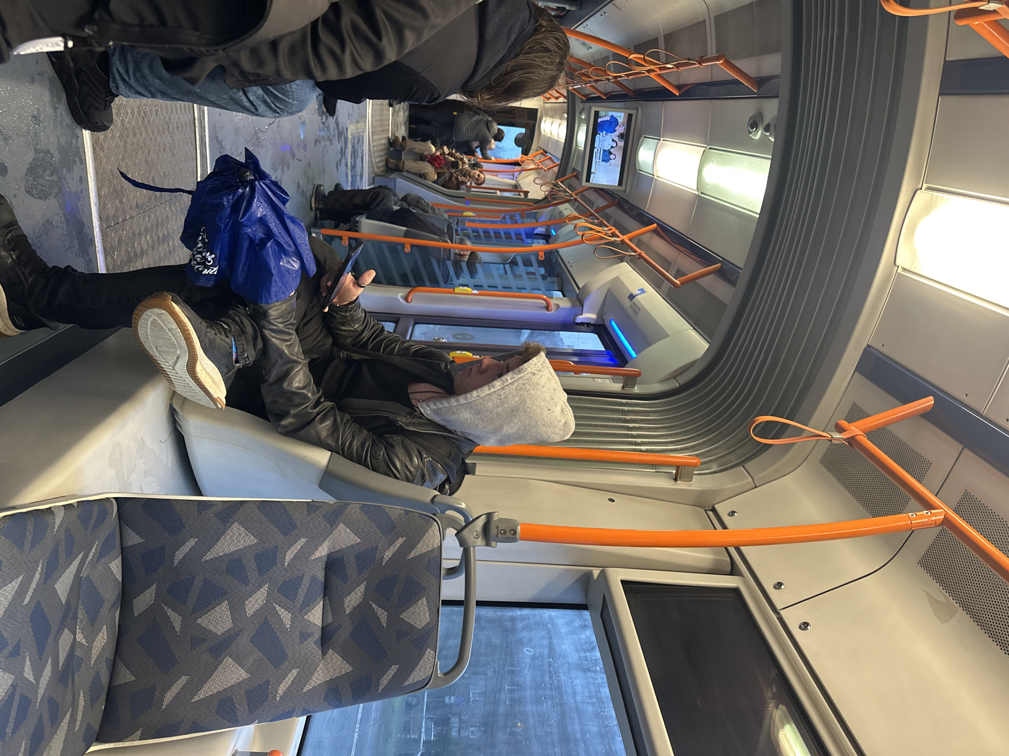 Person rests on public transport seats in Sofia