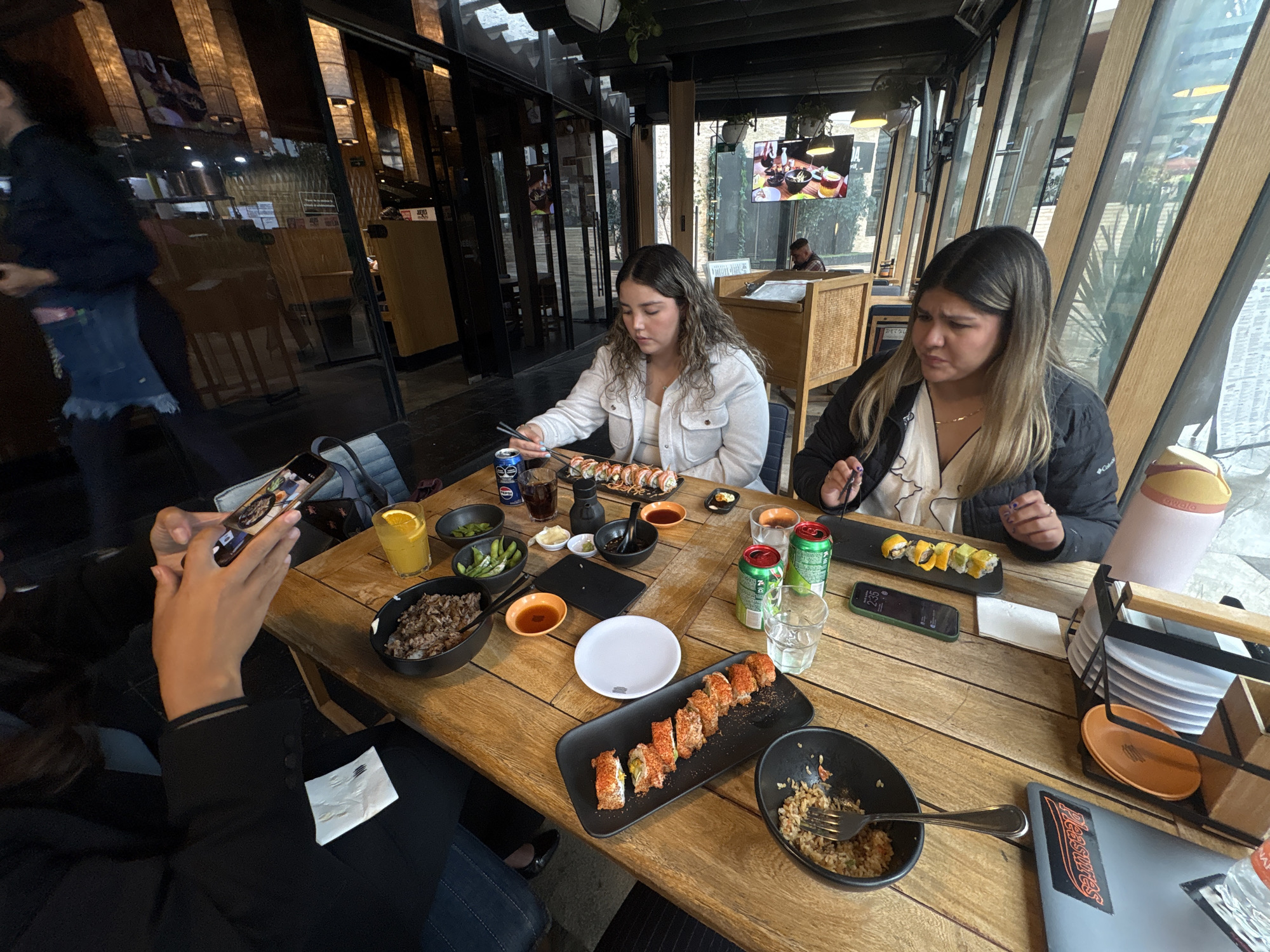 Women enjoy sushi dinner at Mexico City restaurant
