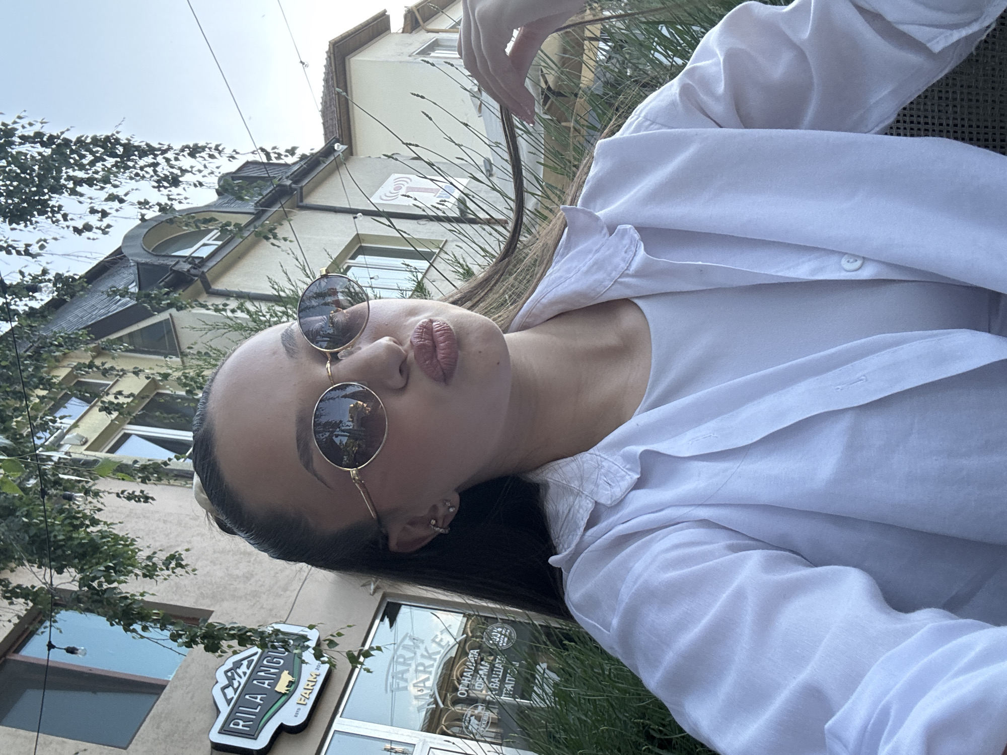 Woman poses for outdoor photos in urban setting