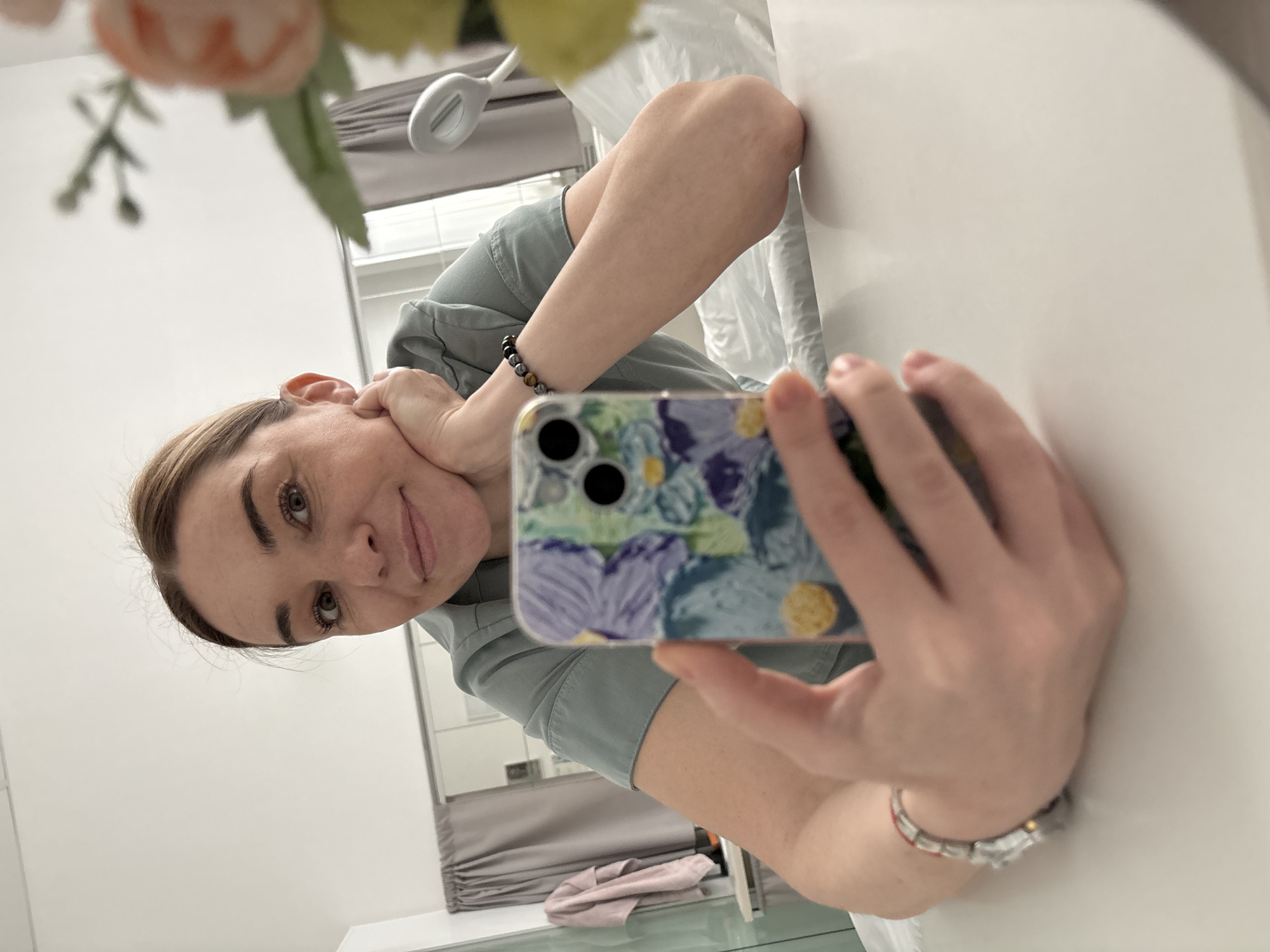 Woman takes mirror selfie in uniform, Romanovka Russia