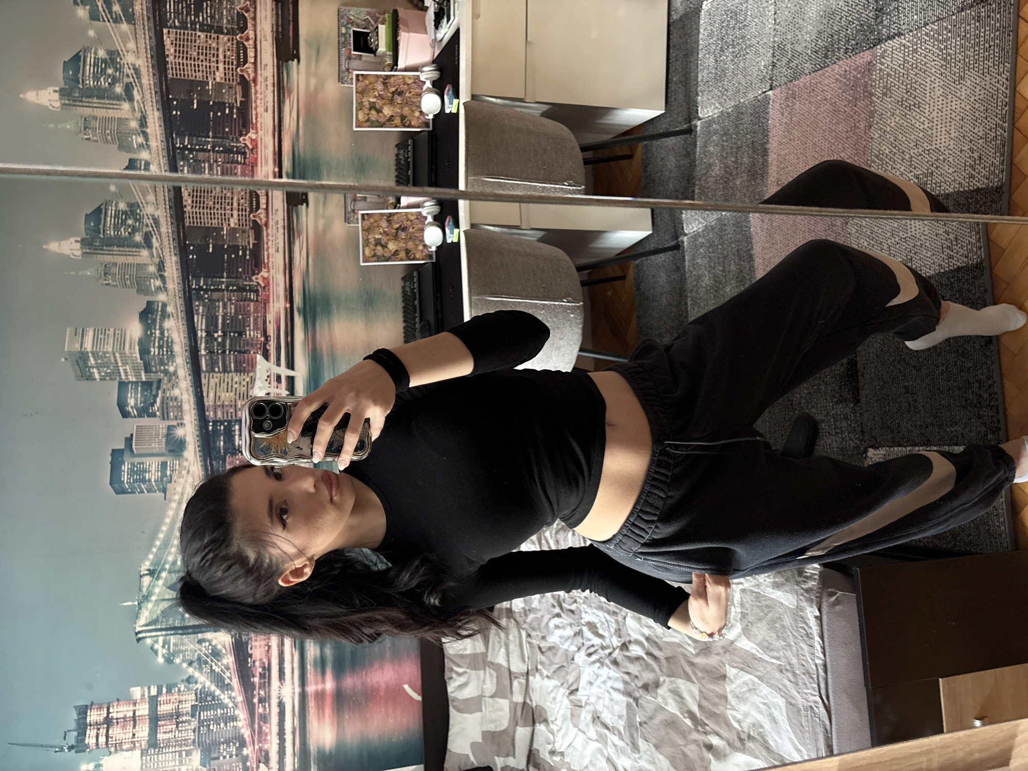 Woman takes multiple mirror selfies in different outfits, Sofia