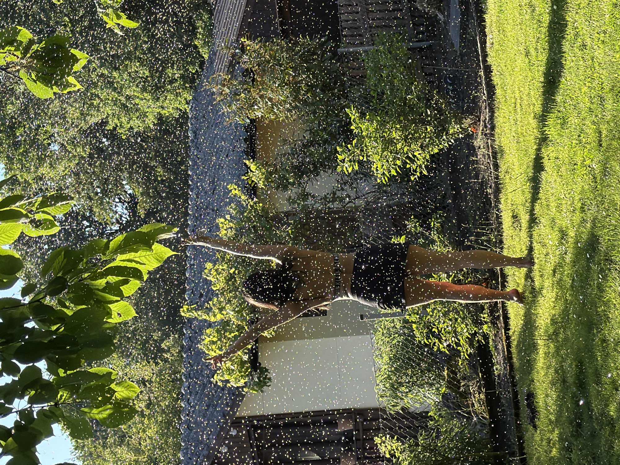 Person tends garden, practices yoga in Nuremberg yard