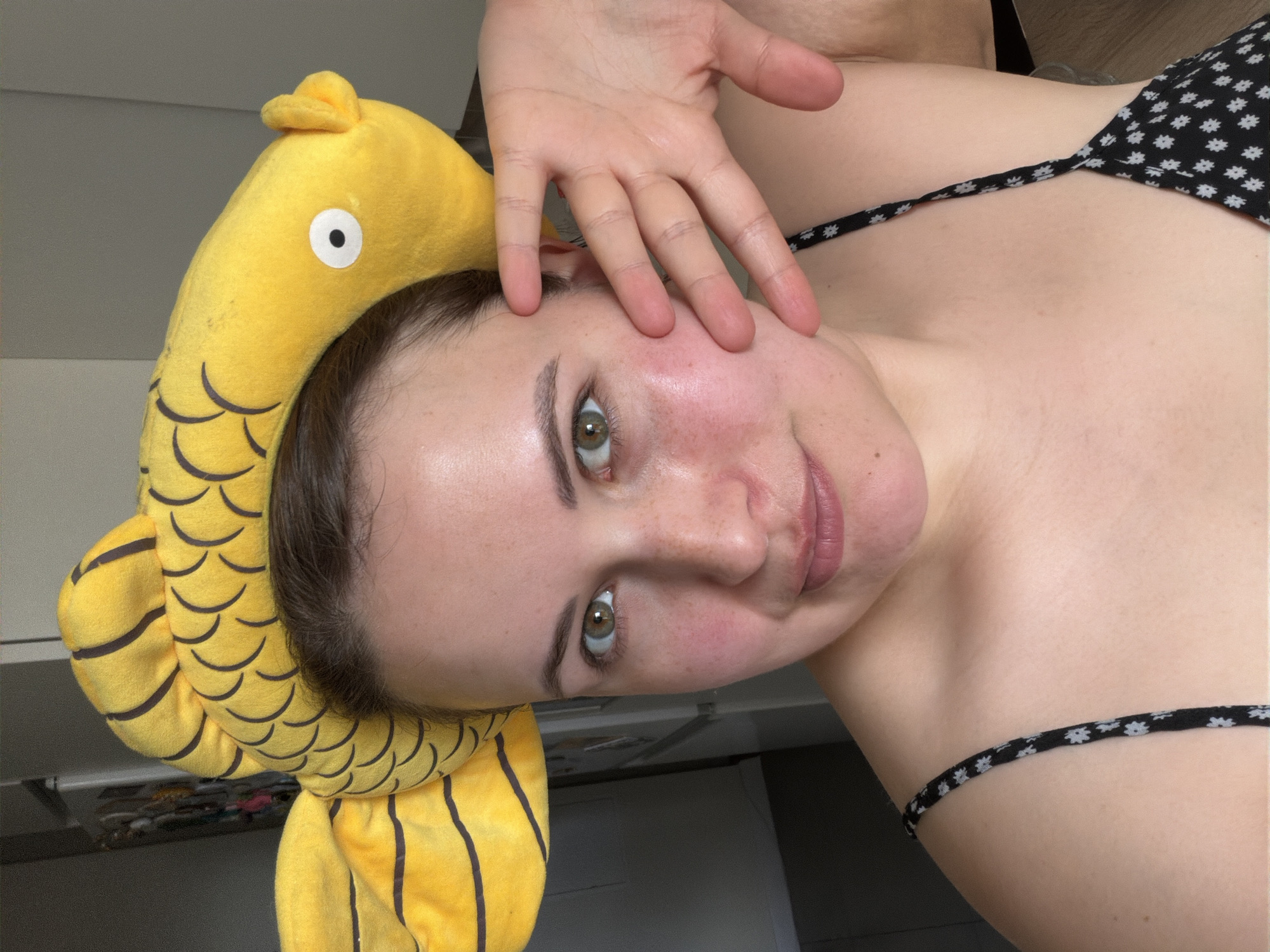 Woman in fish hat spotted indoors in Riga