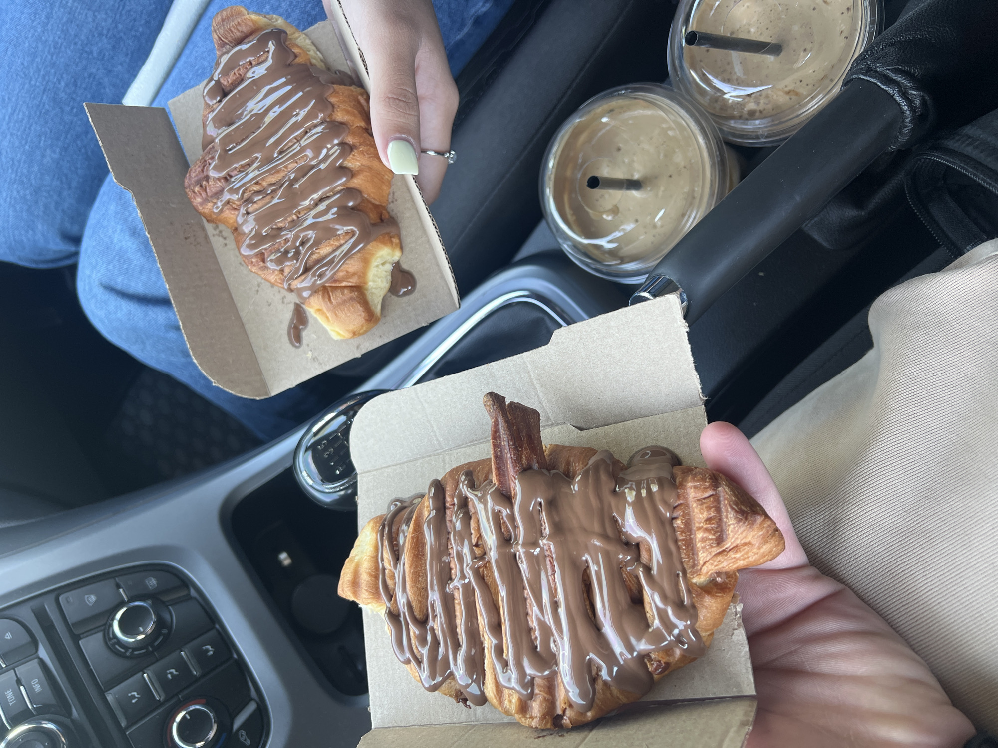 Travelers Share Chocolate Croissants in Car in Dabnitsa, Bulgaria