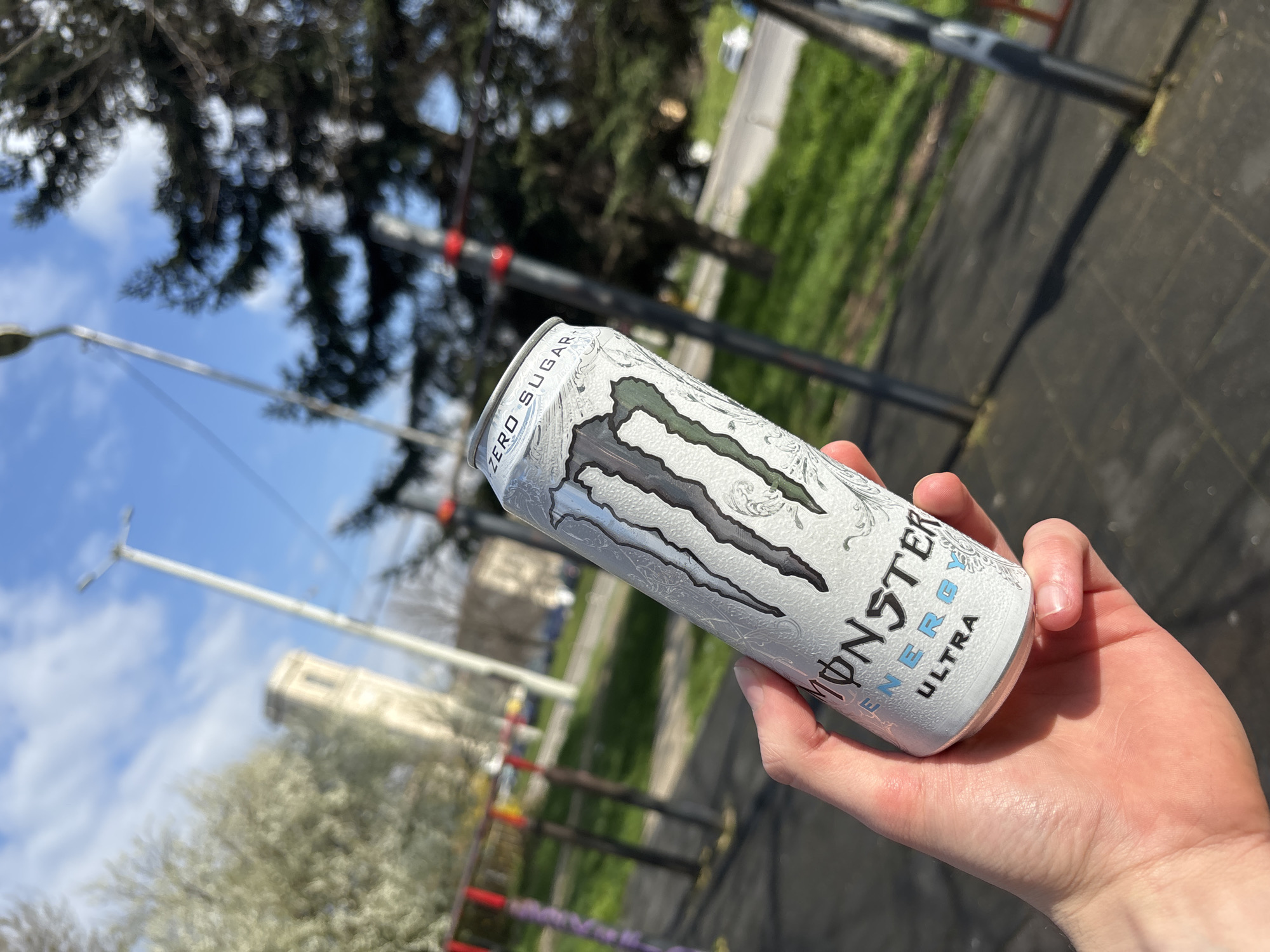 Person holds energy drink outdoors in Ruse, Bulgaria