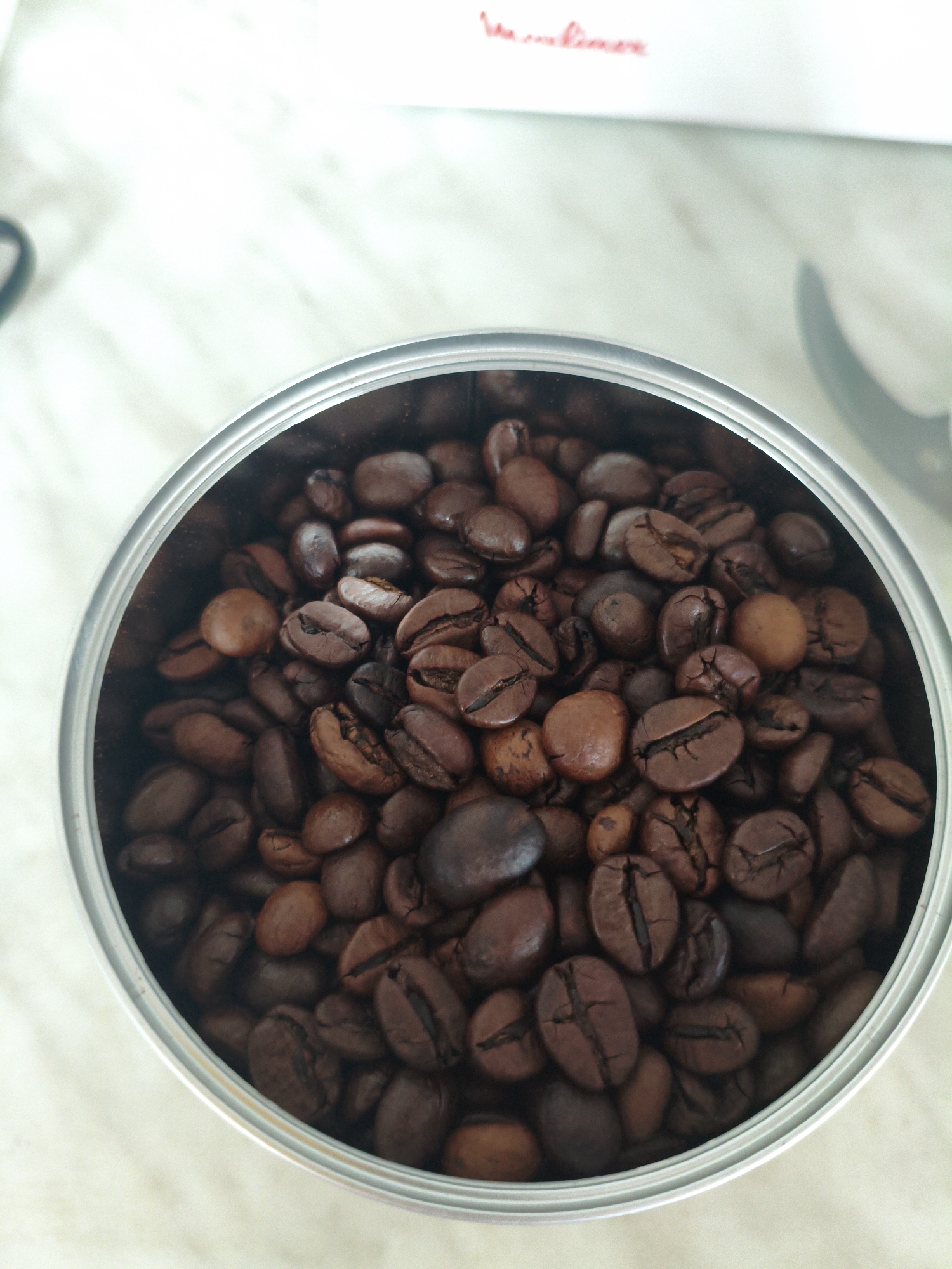 Coffee beans and wrapped candies in close-up shots