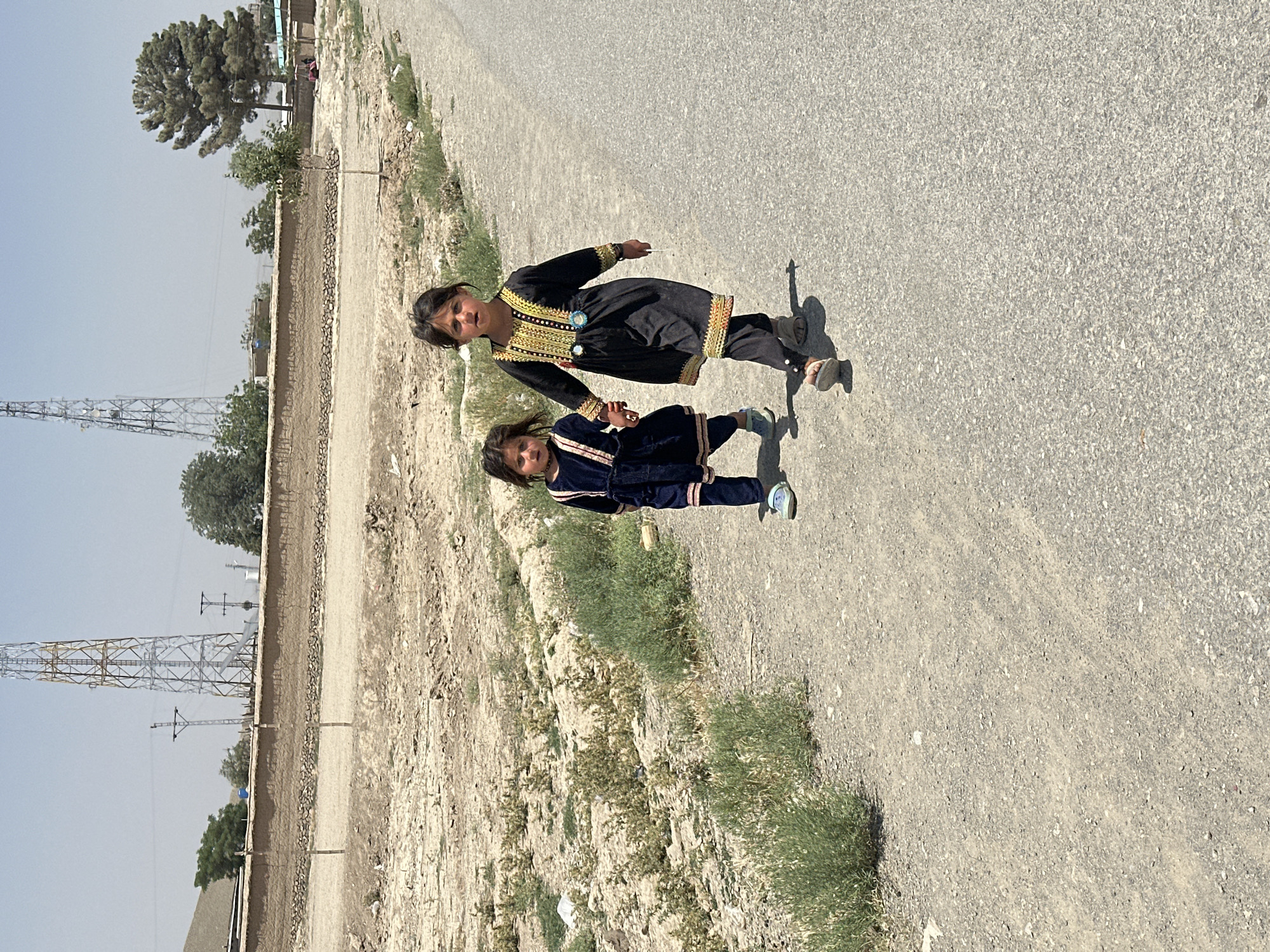 Daily life documented in Kanozai: children walking, junkyard scenes