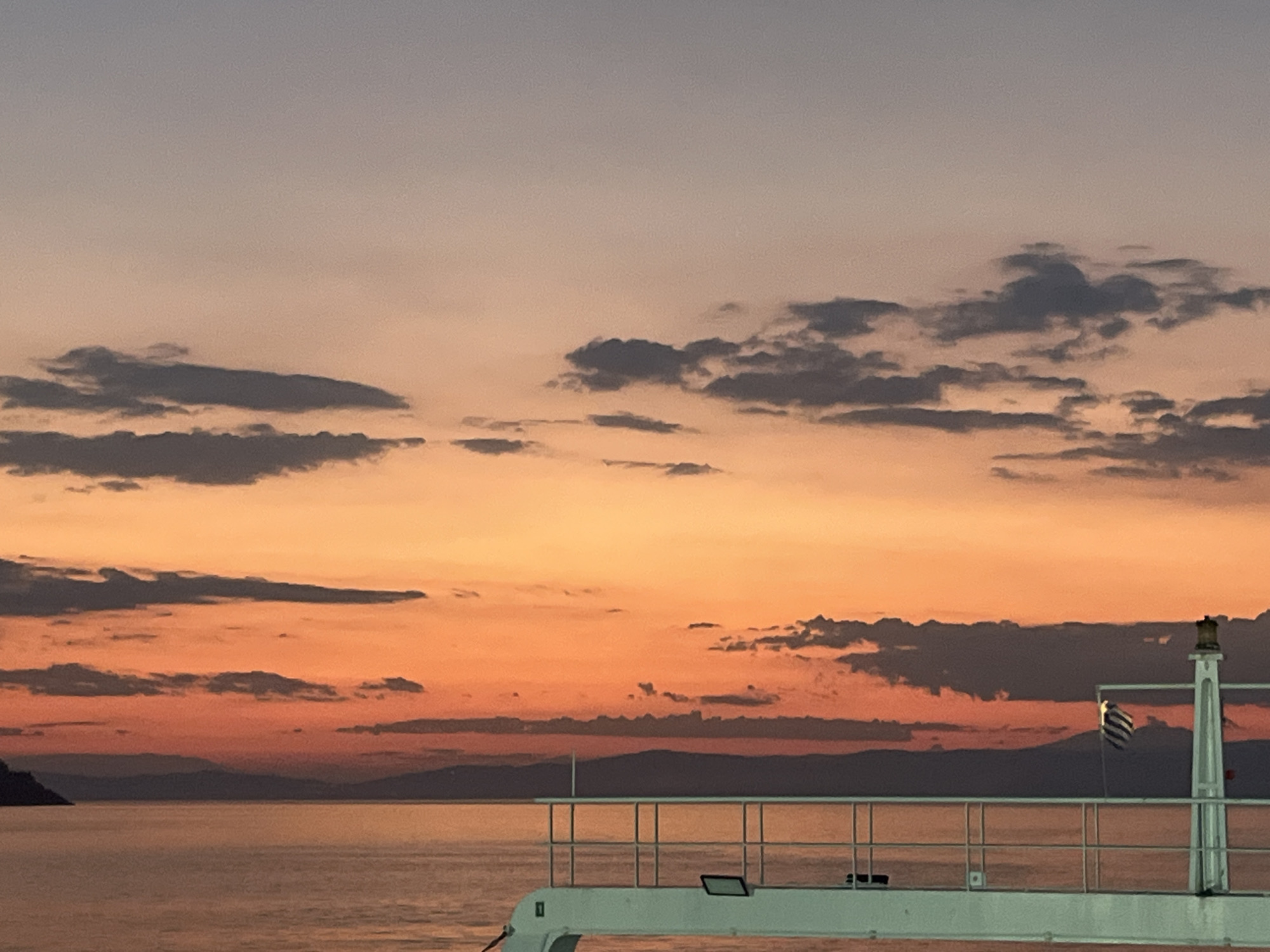 Sunset over the Thassian Sea from a ferry deck