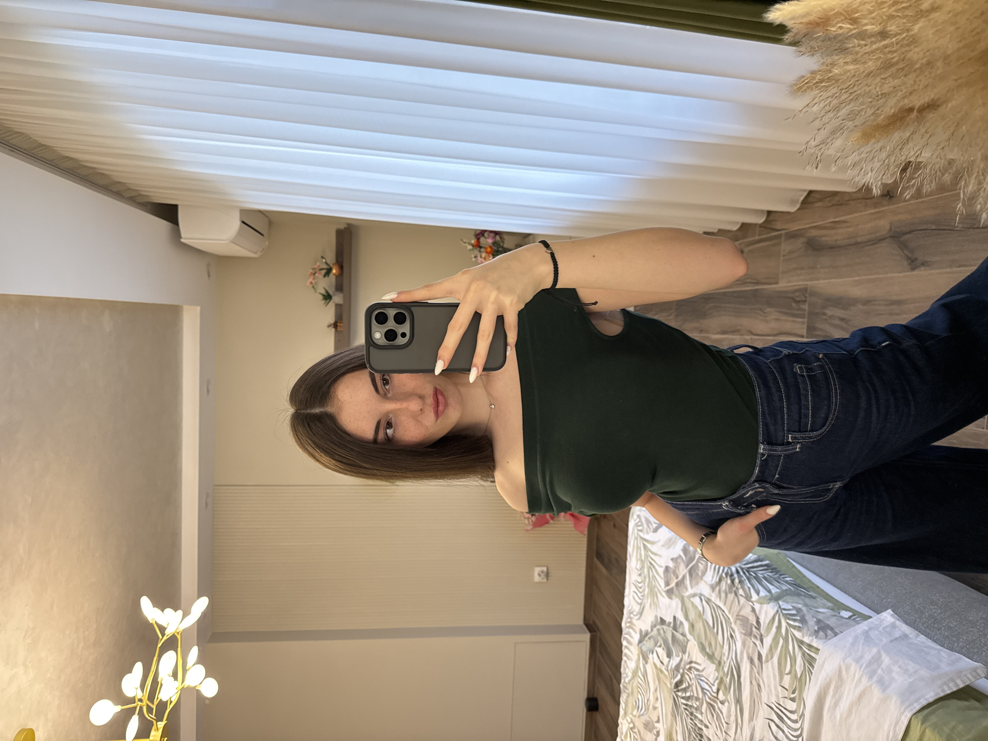 Woman takes selfie in residential interior, Trud Bulgaria