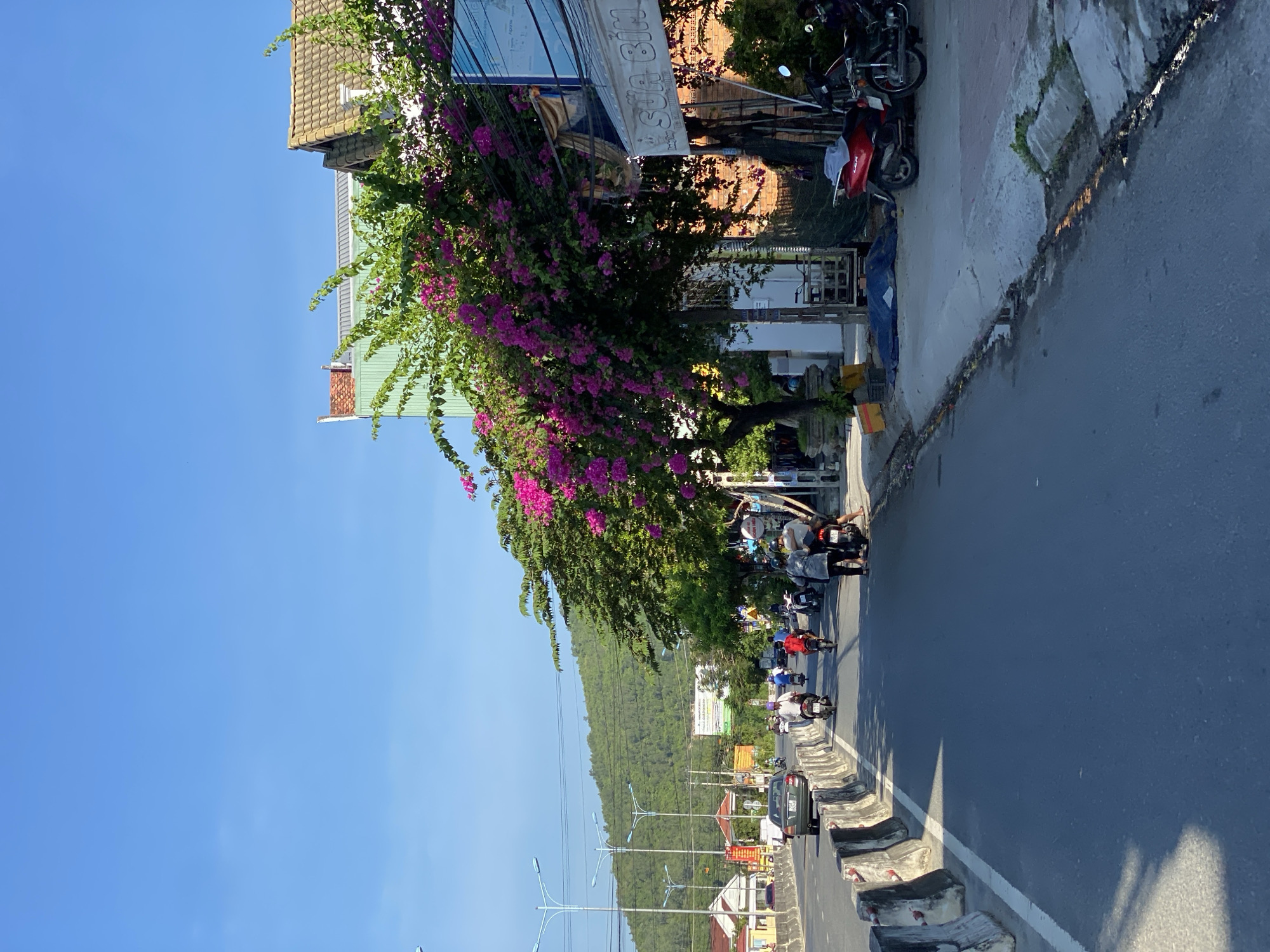 Street-level scenes through a busy Southeast Asian city district