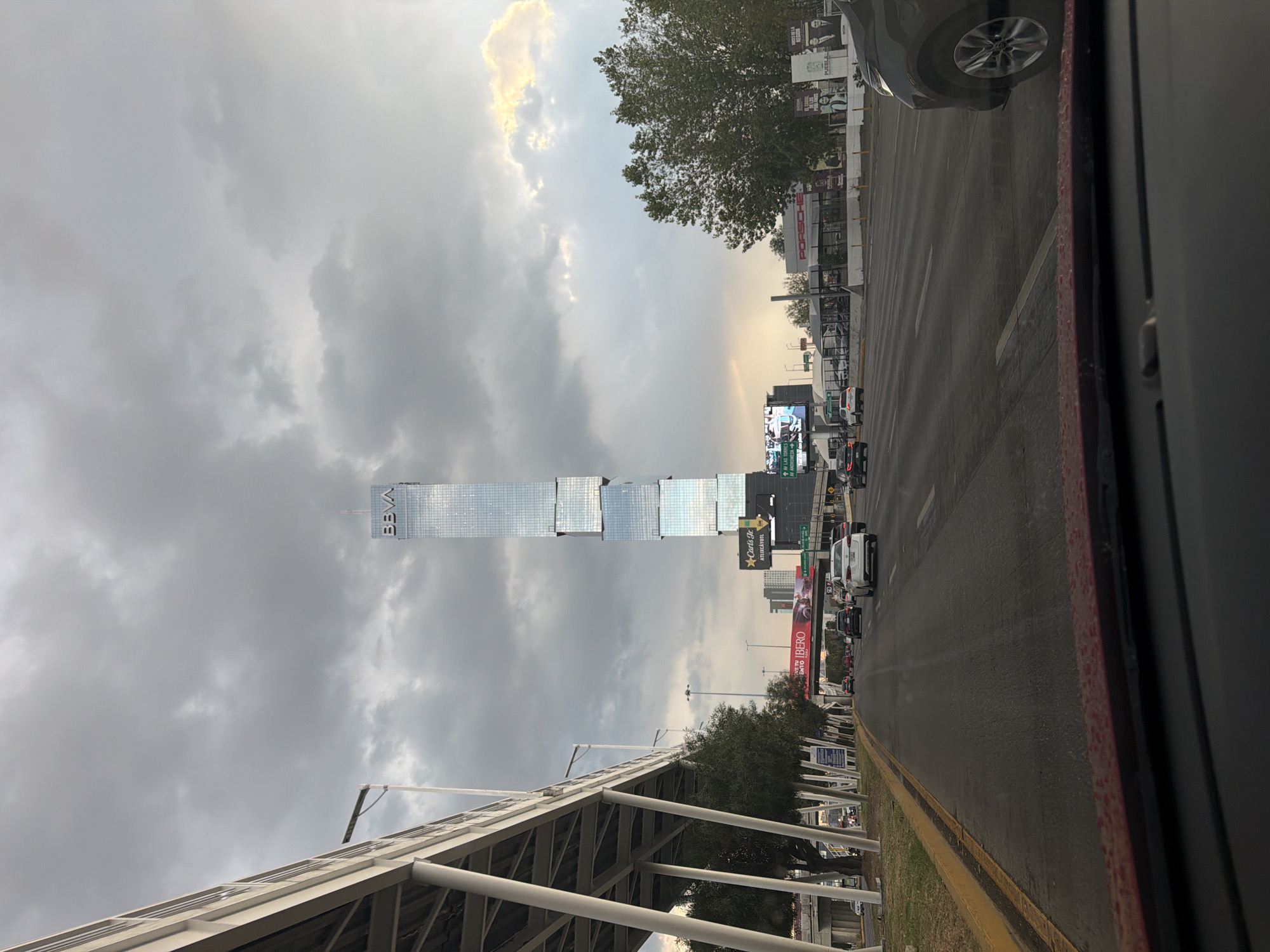 Traffic flows past BBVA tower in Puebla, Mexico