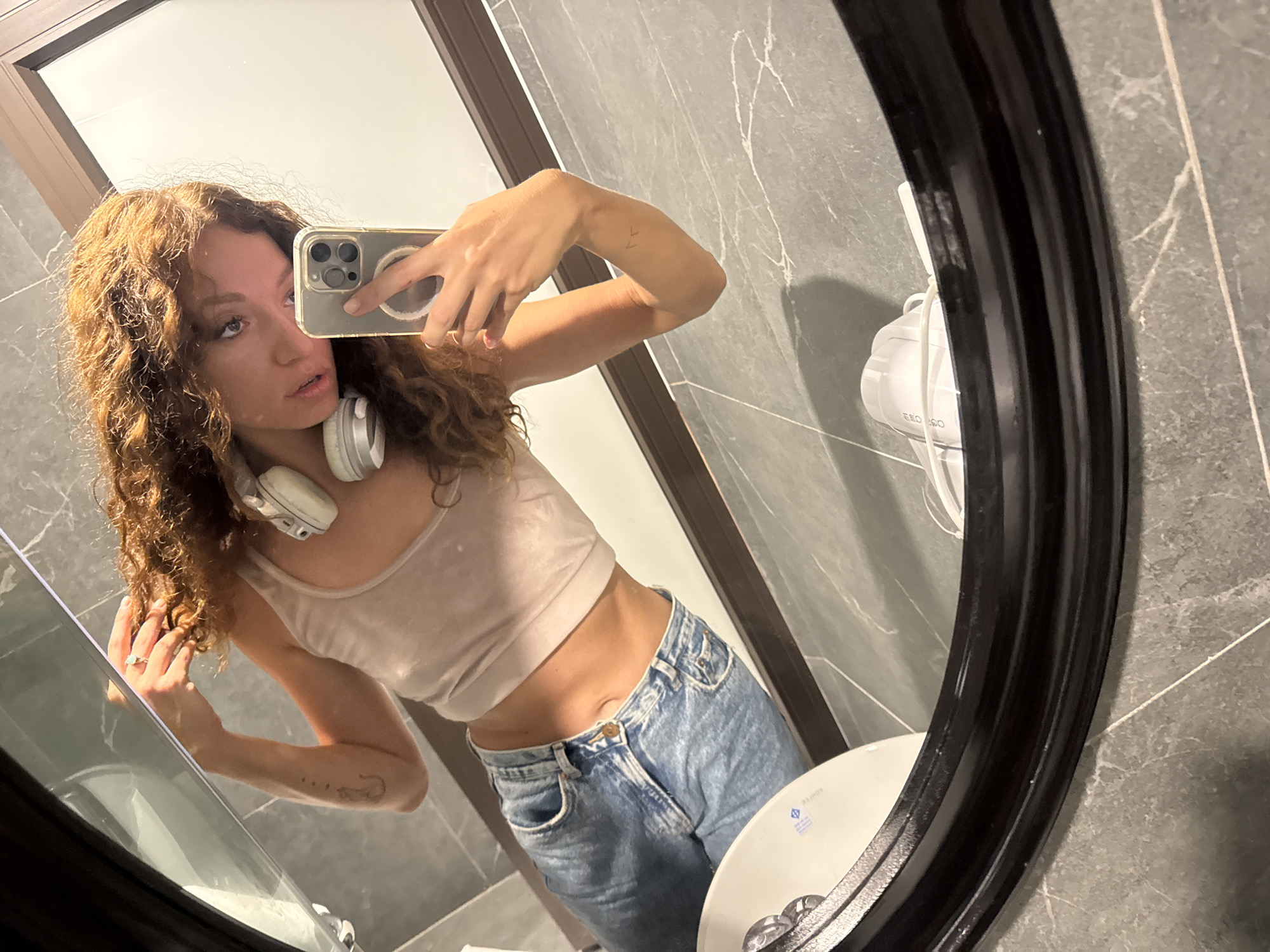 Woman takes bathroom selfie in Hanoi early morning